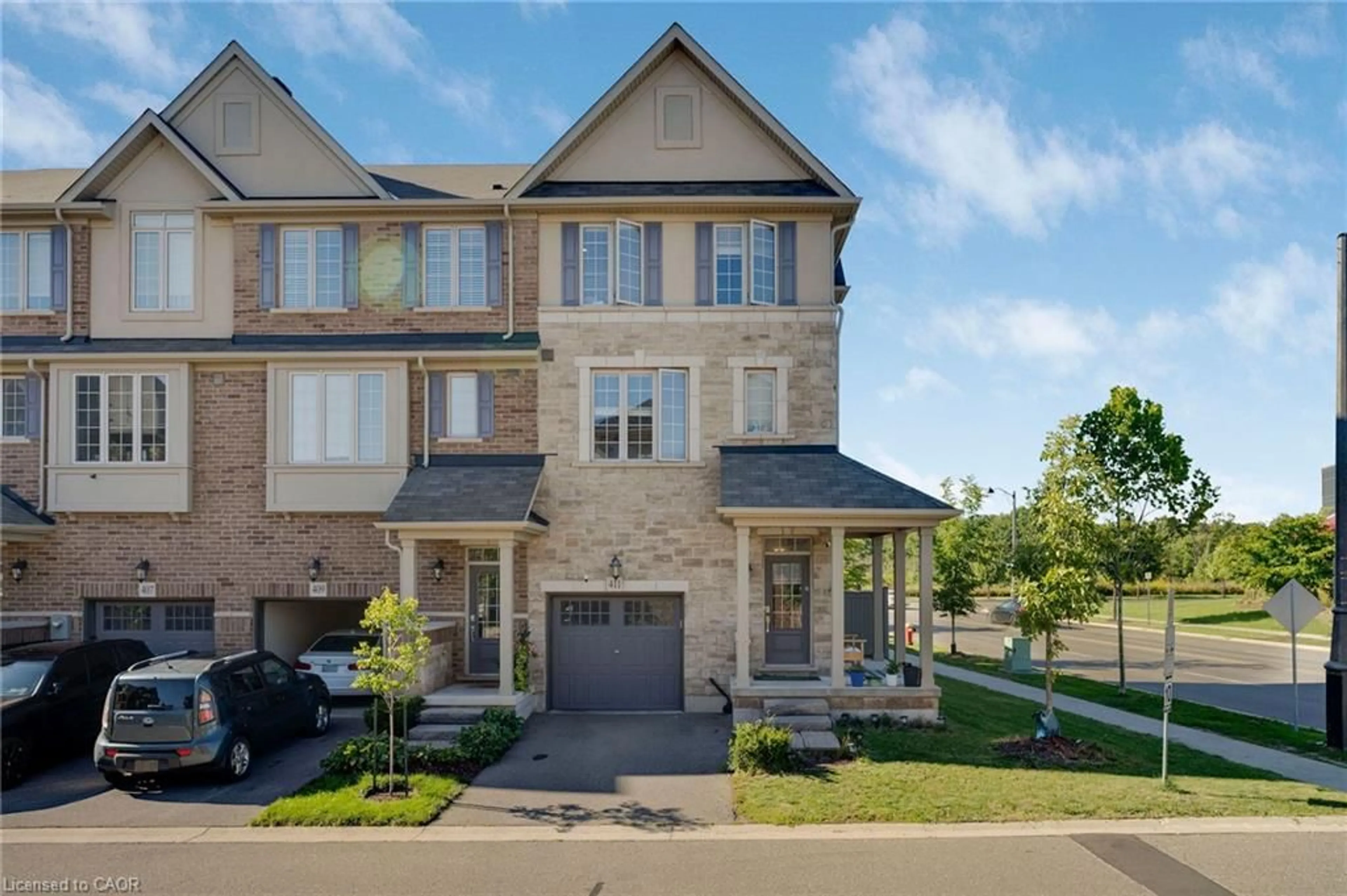 Home with brick exterior material, street for 411 Hardwick Common, Oakville Ontario L6H 0P8