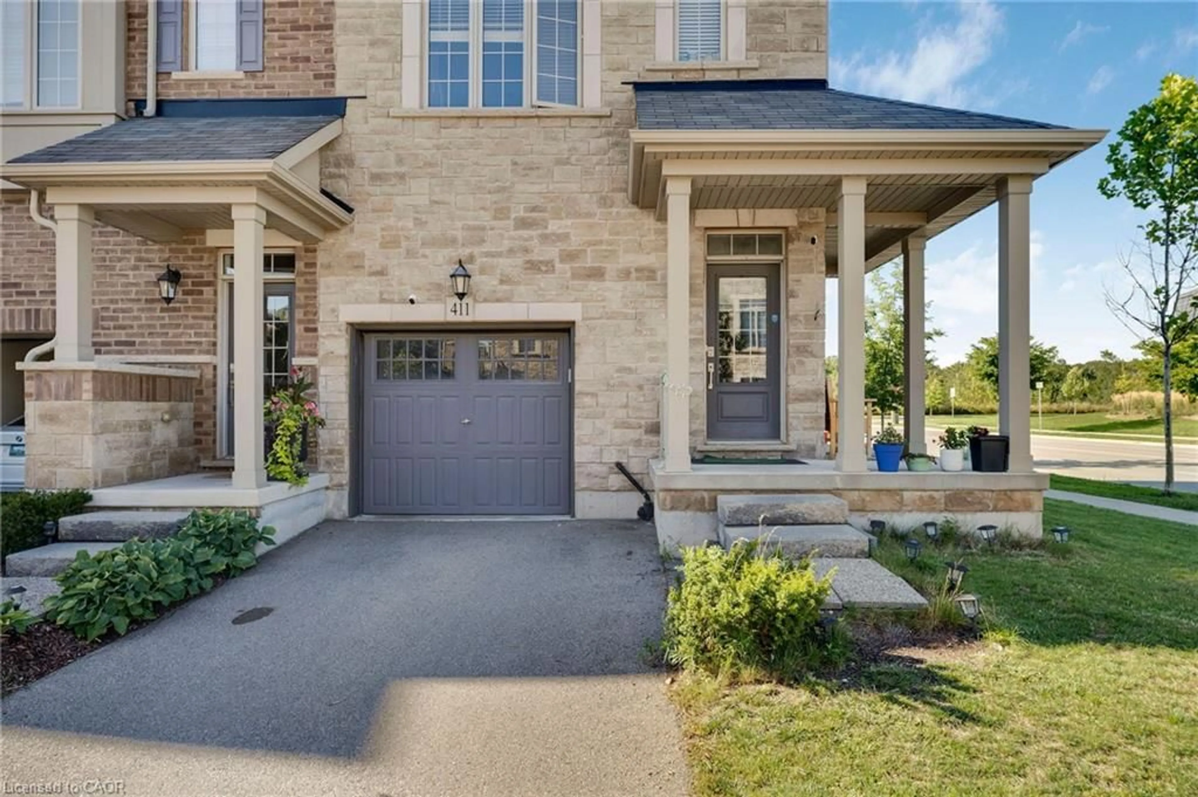 Home with brick exterior material, street for 411 Hardwick Common, Oakville Ontario L6H 0P8