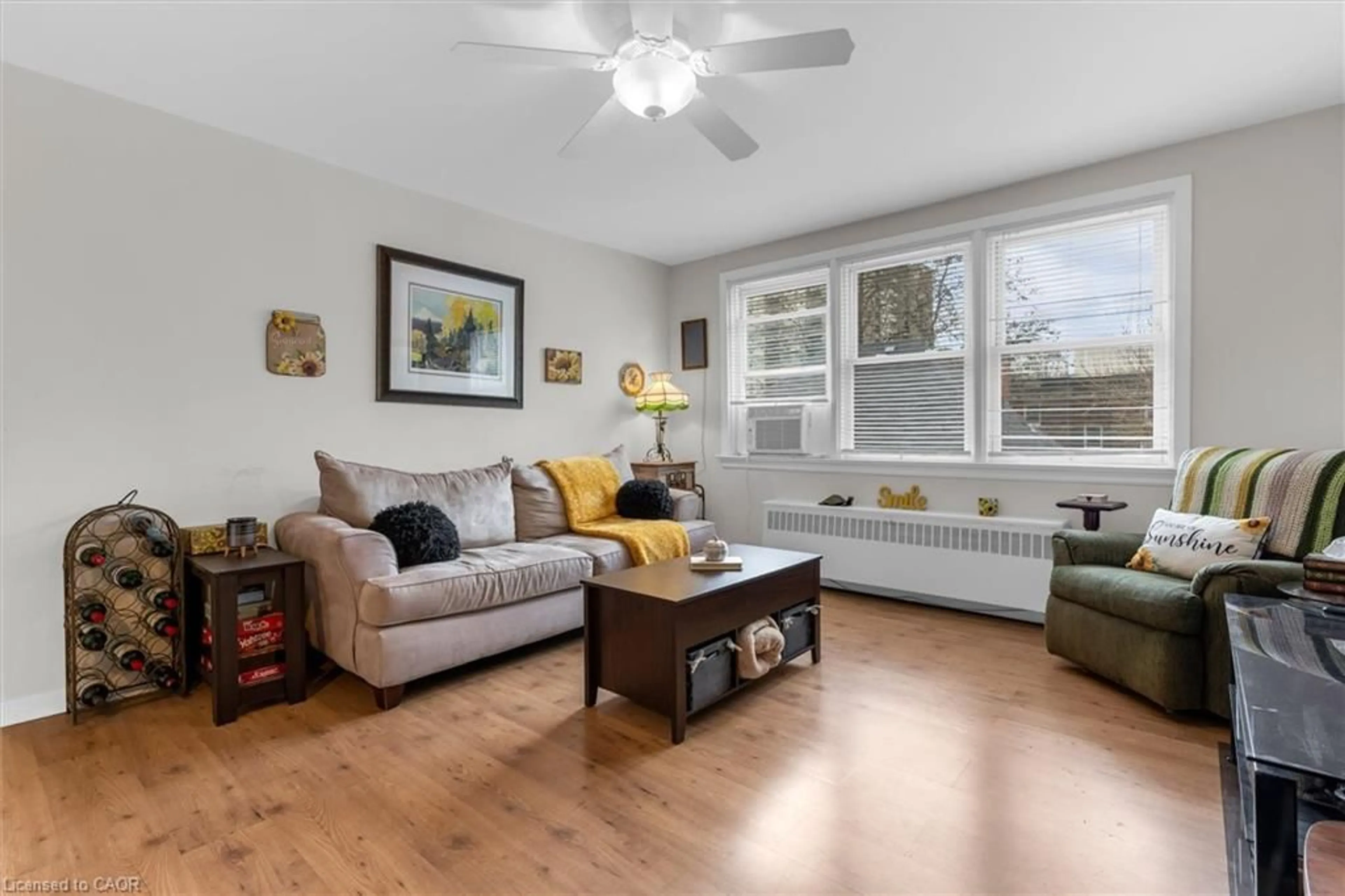 Living room with furniture, wood/laminate floor for 4 Robinson St #14, Hamilton Ontario L8P 1Y5