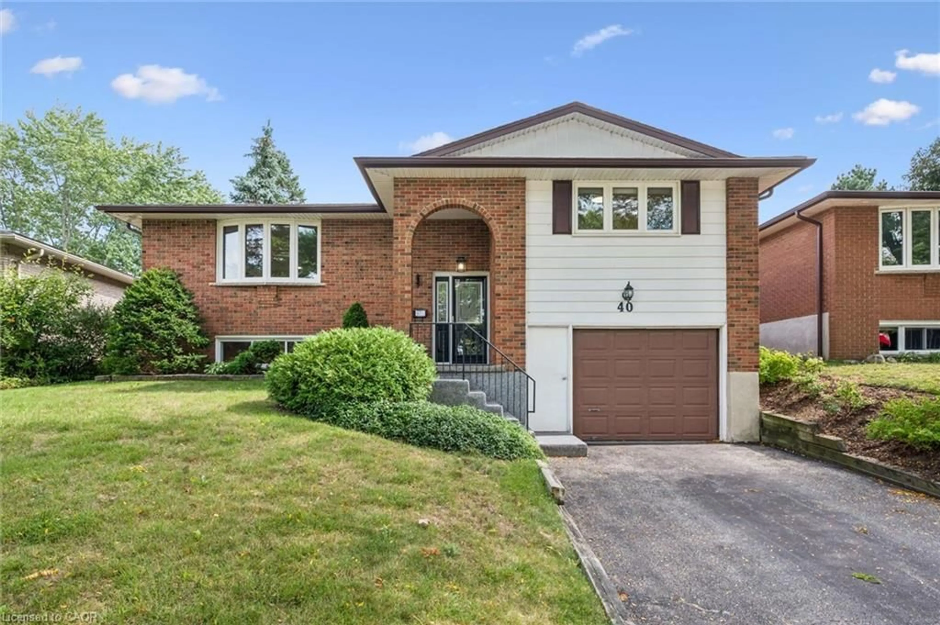 Home with brick exterior material, street for 40 Bishop Crt, Guelph Ontario N1G 2R9