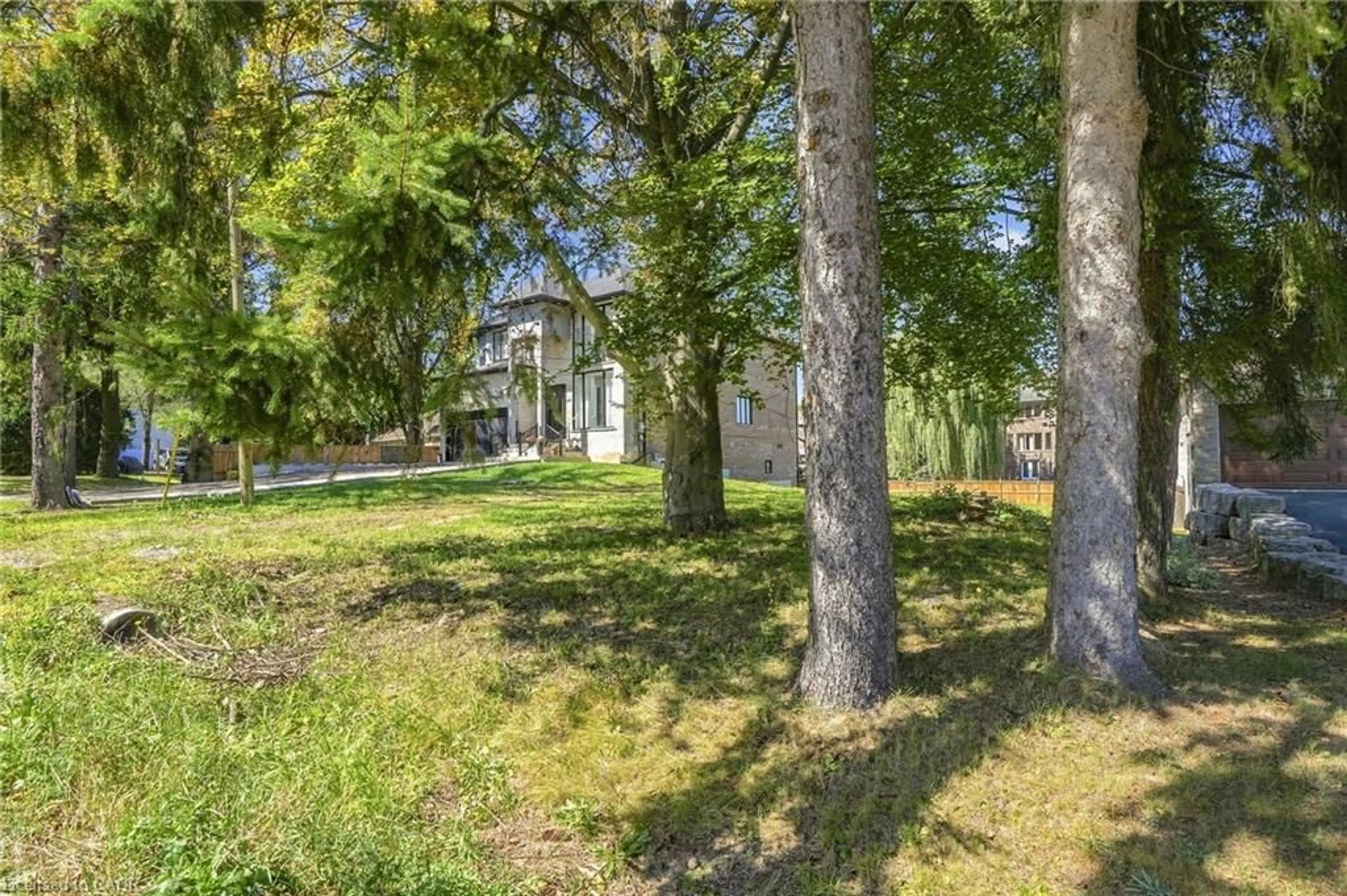 A pic from outside/outdoor area/front of a property/back of a property/a pic from drone, forest/trees view for 657 Mohawk Rd, Ancaster Ontario L9G 2X1