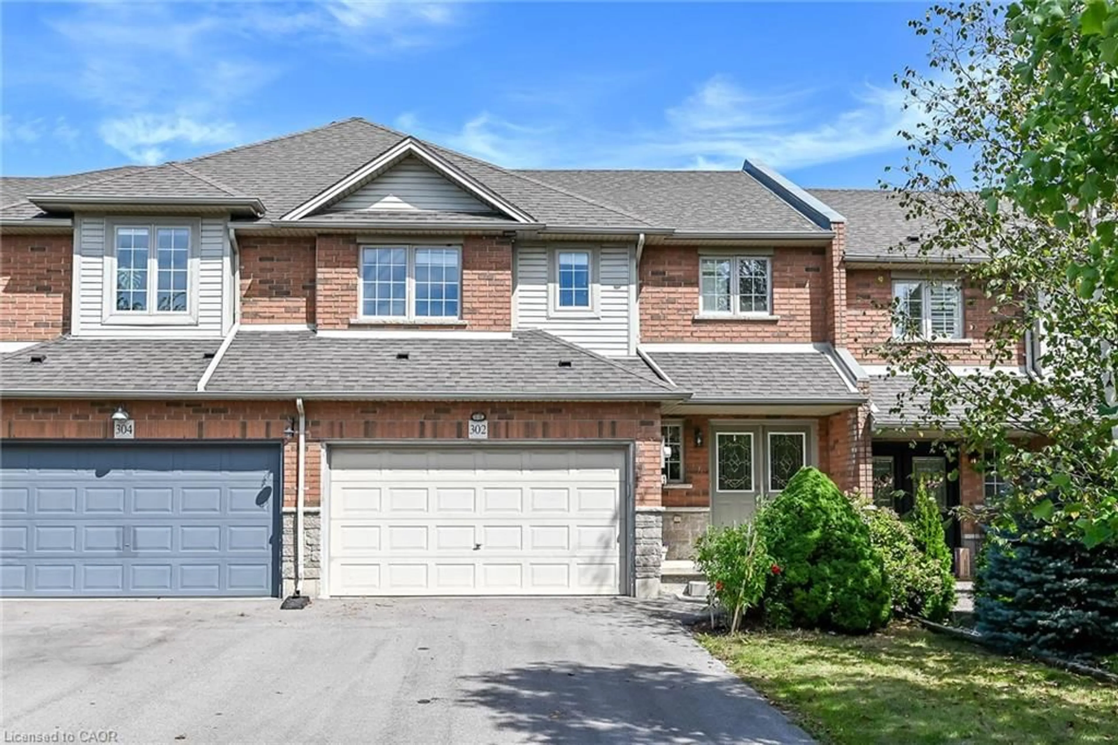 Home with brick exterior material, street for 302 Southbrook Dr, Binbrook Ontario L0R 1C0