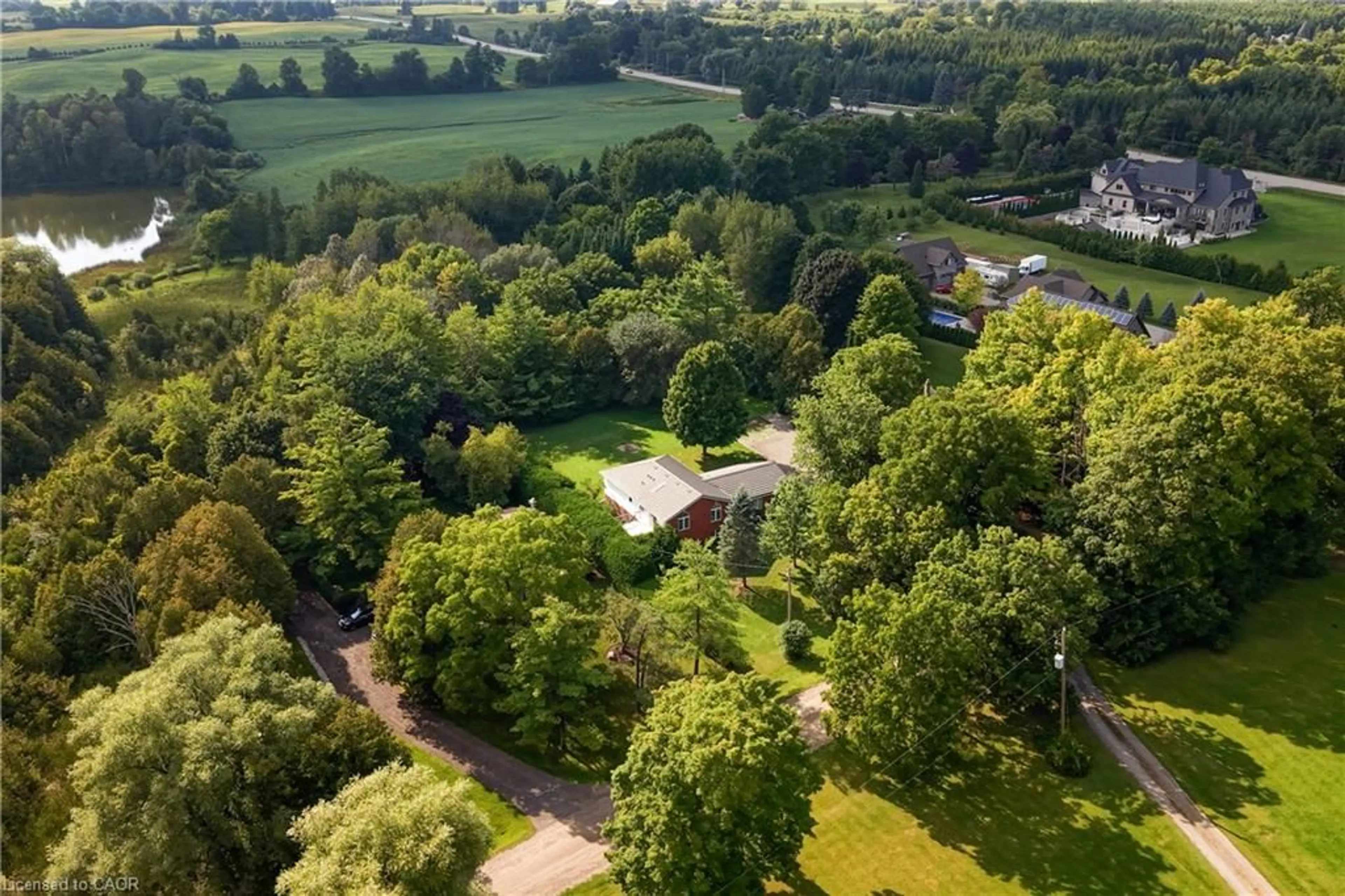 A pic from outside/outdoor area/front of a property/back of a property/a pic from drone, forest/trees view for 4452 Sideroad 20 Rd, Centre Wellington Ontario N0B 2J0