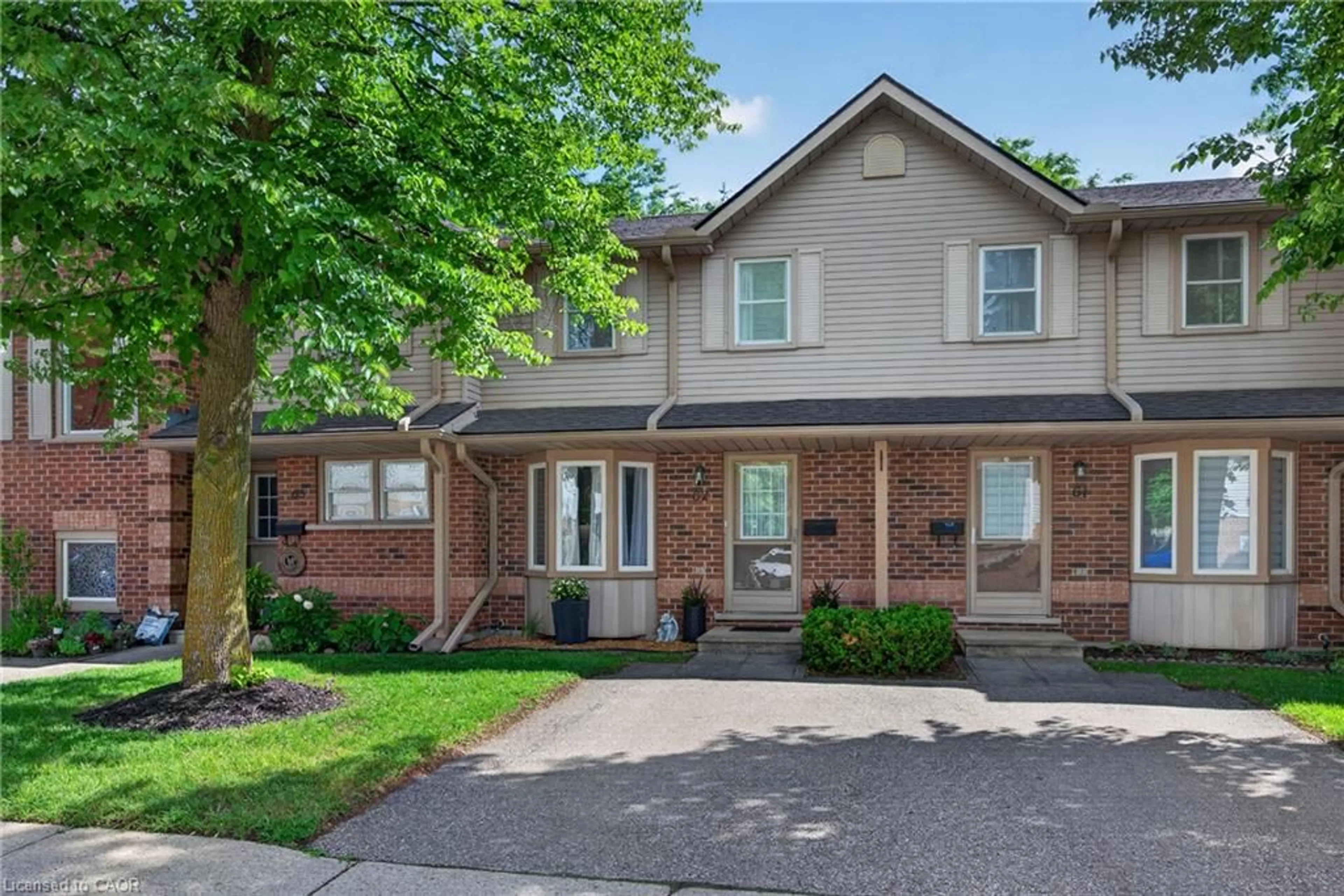 Home with brick exterior material, street for 180 Marksam Rd #62, Guelph Ontario N1H 8G4