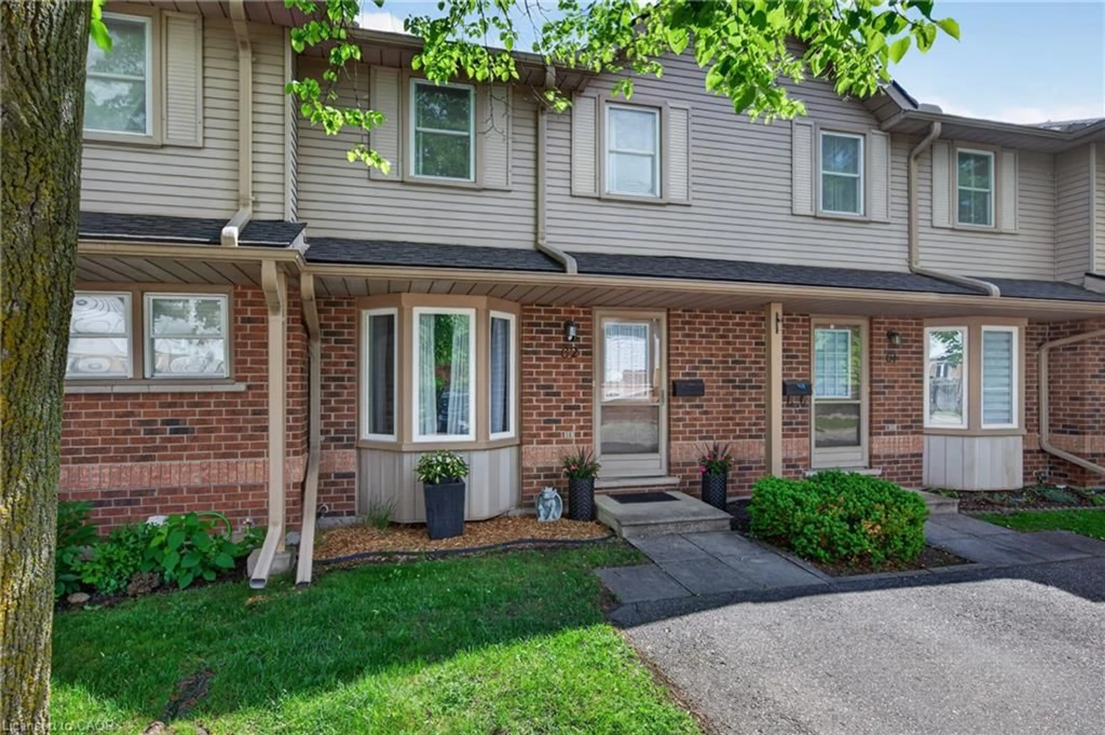 Home with brick exterior material, street for 180 Marksam Rd #62, Guelph Ontario N1H 8G4