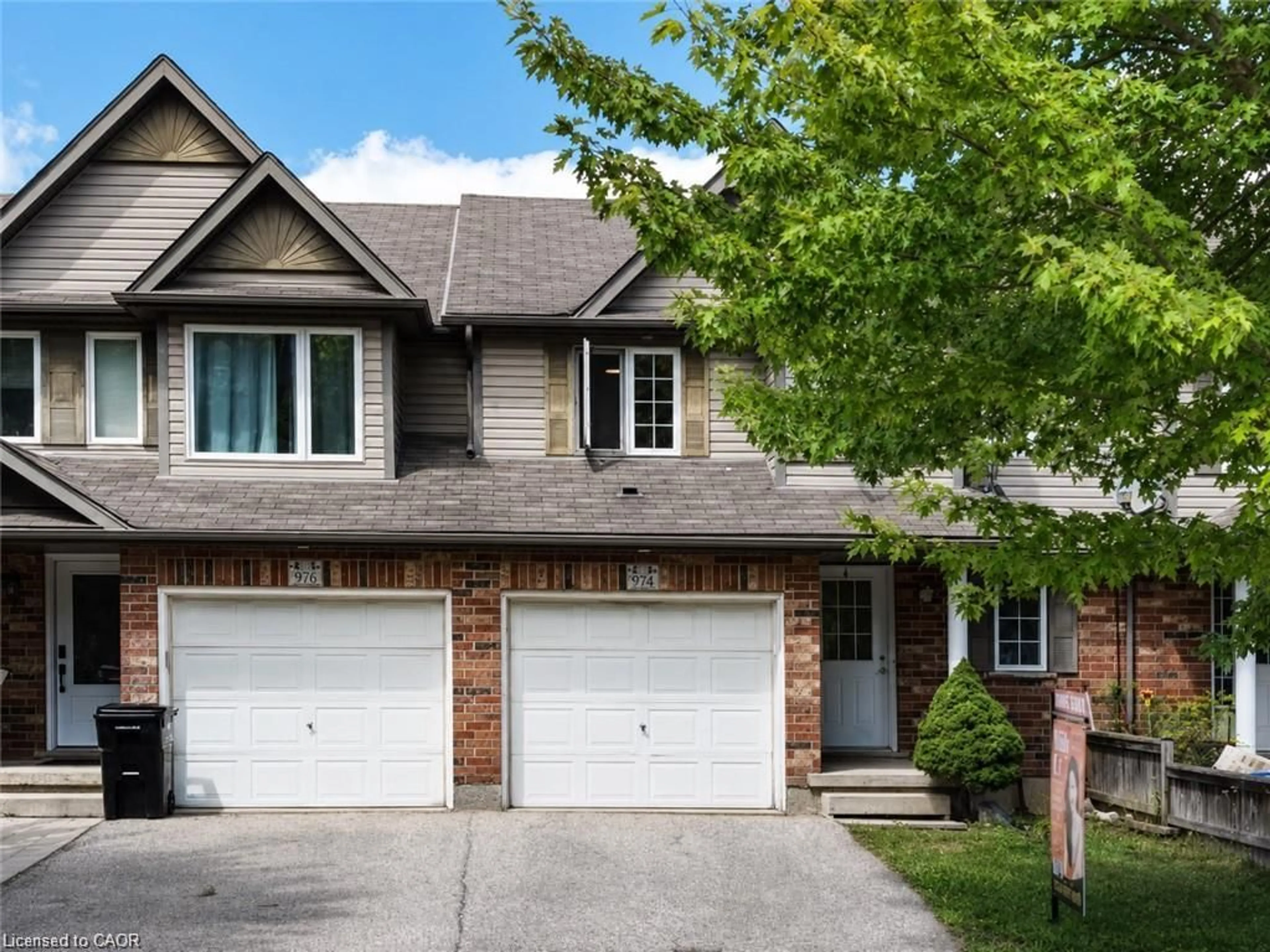 Home with brick exterior material, street for 974 Creekside Dr, Waterloo Ontario N2V 2W5