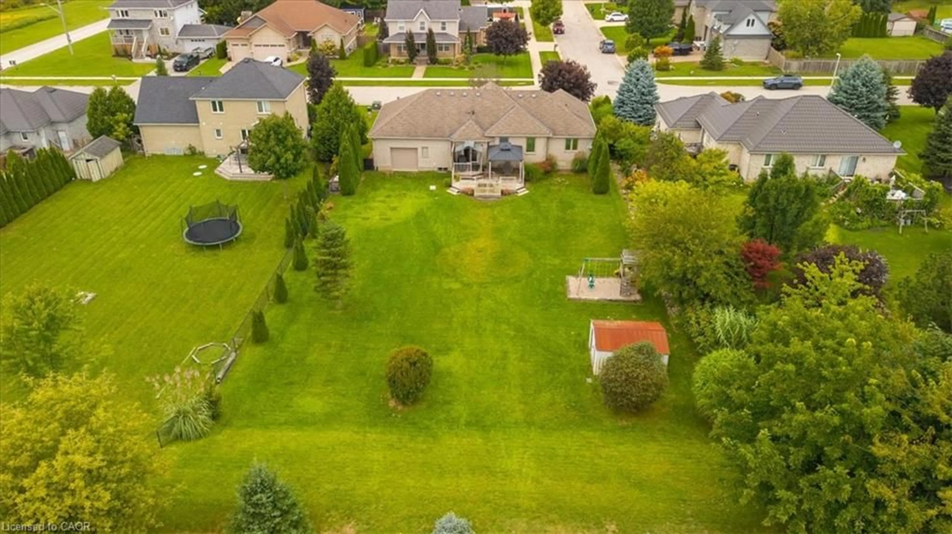 A pic from outside/outdoor area/front of a property/back of a property/a pic from drone, street for 515 Woodward Dr, Mount Brydges Ontario N0L 1W0