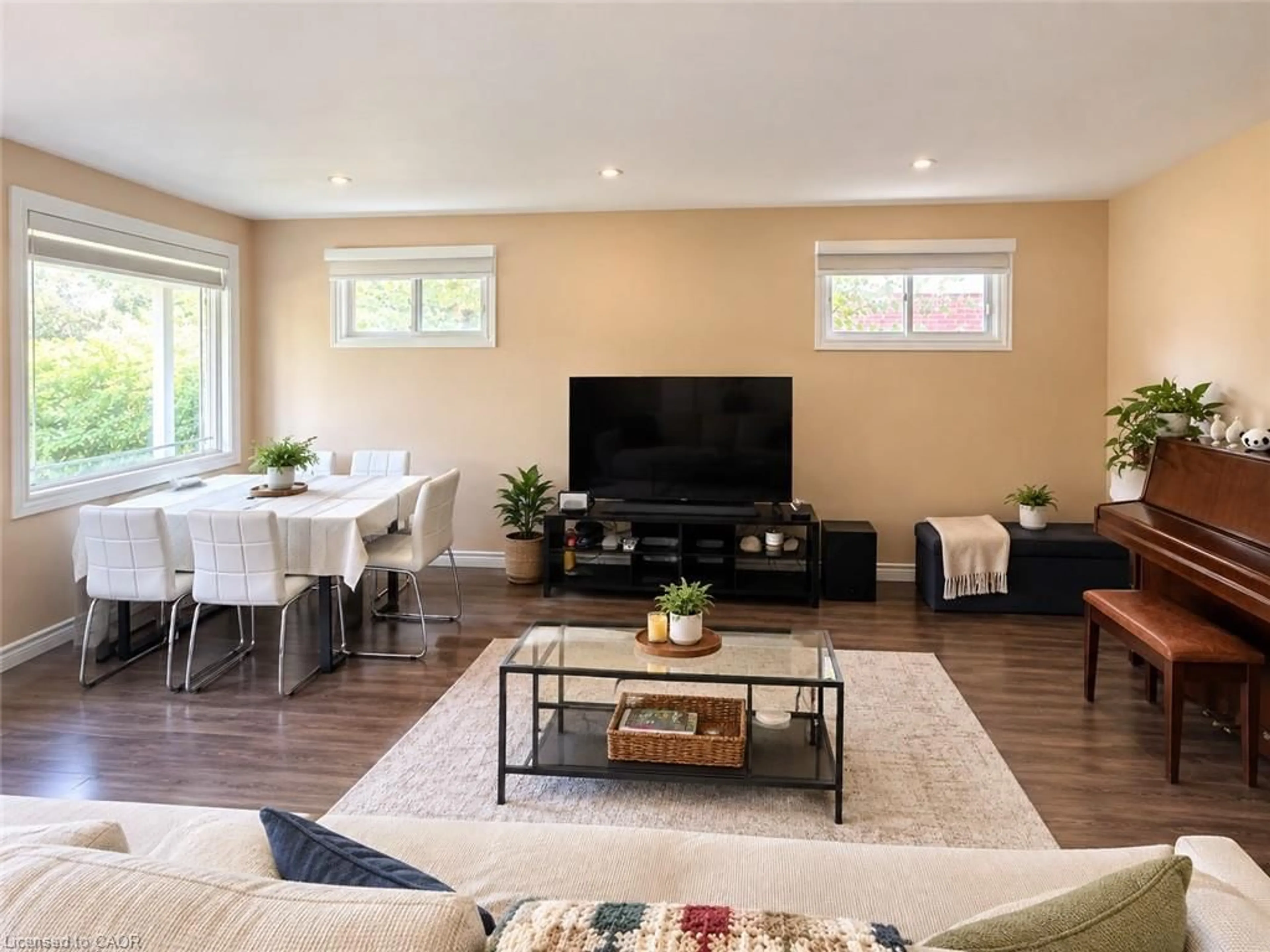 Living room with furniture, wood/laminate floor for 73 Larkspur Cres, Kitchener Ontario N2M 4W8