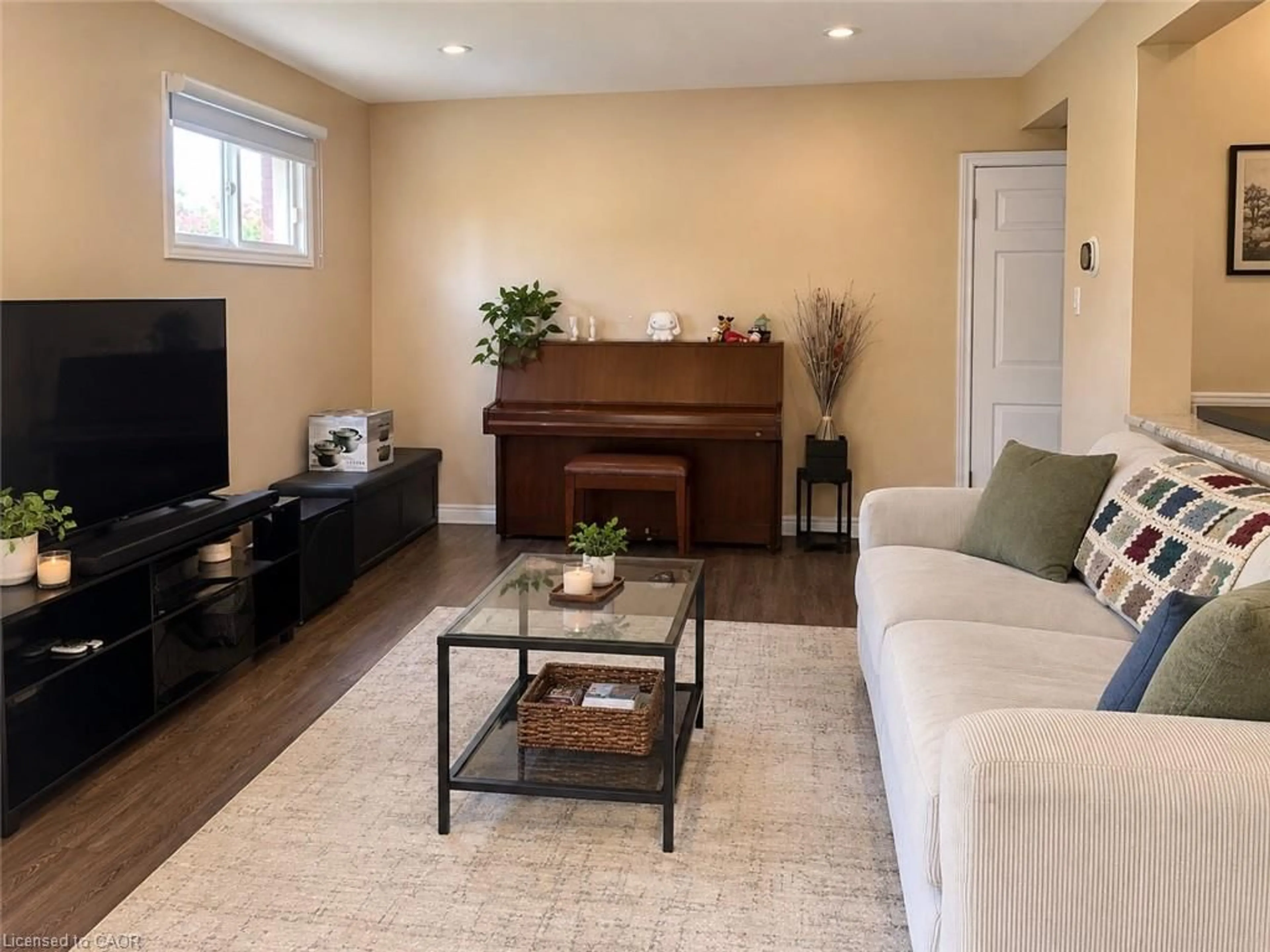 Living room with furniture, wood/laminate floor for 73 Larkspur Cres, Kitchener Ontario N2M 4W8