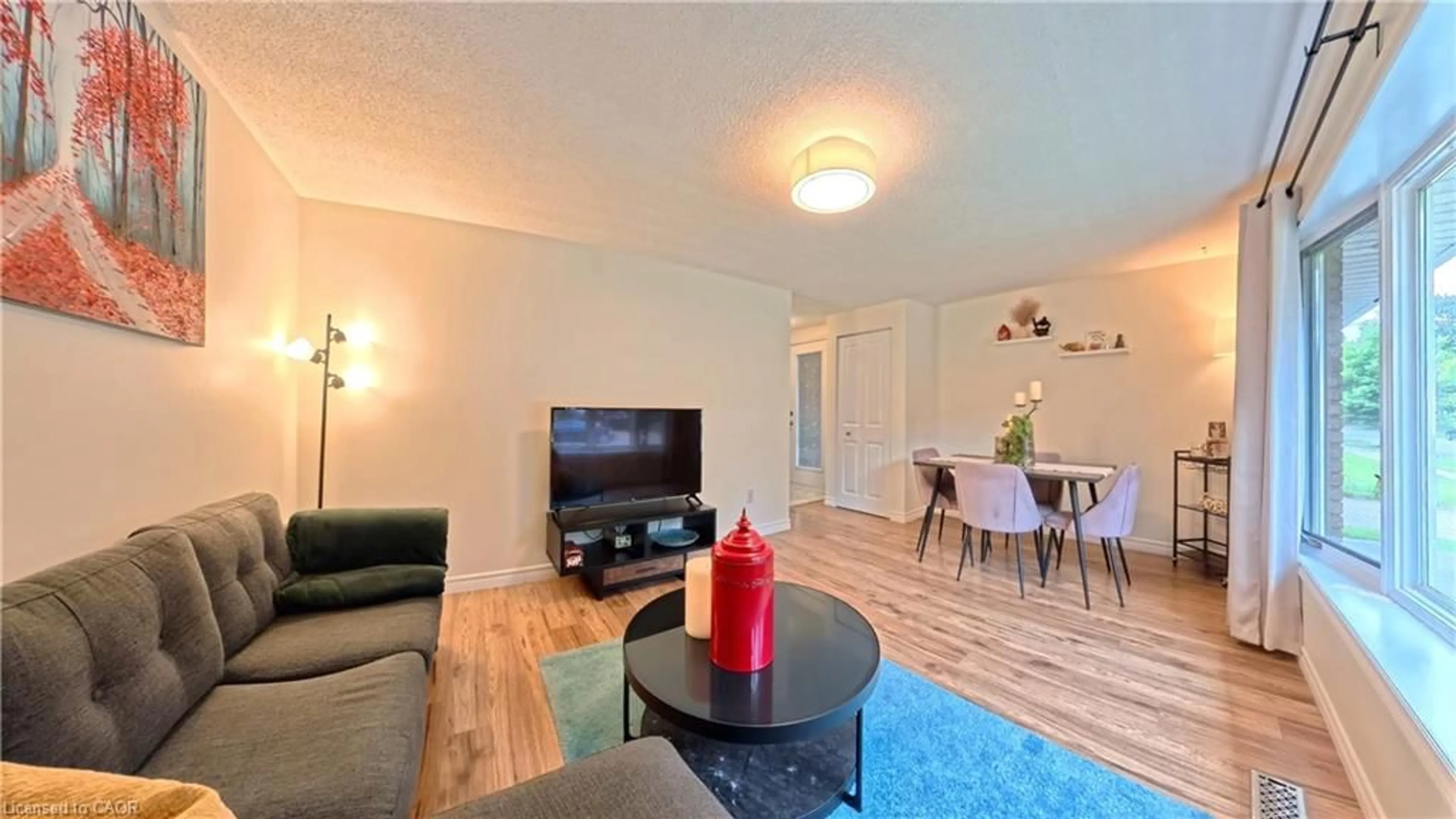 Living room with furniture, wood/laminate floor for 380 Grangewood Dr, Waterloo Ontario N2K 2E6