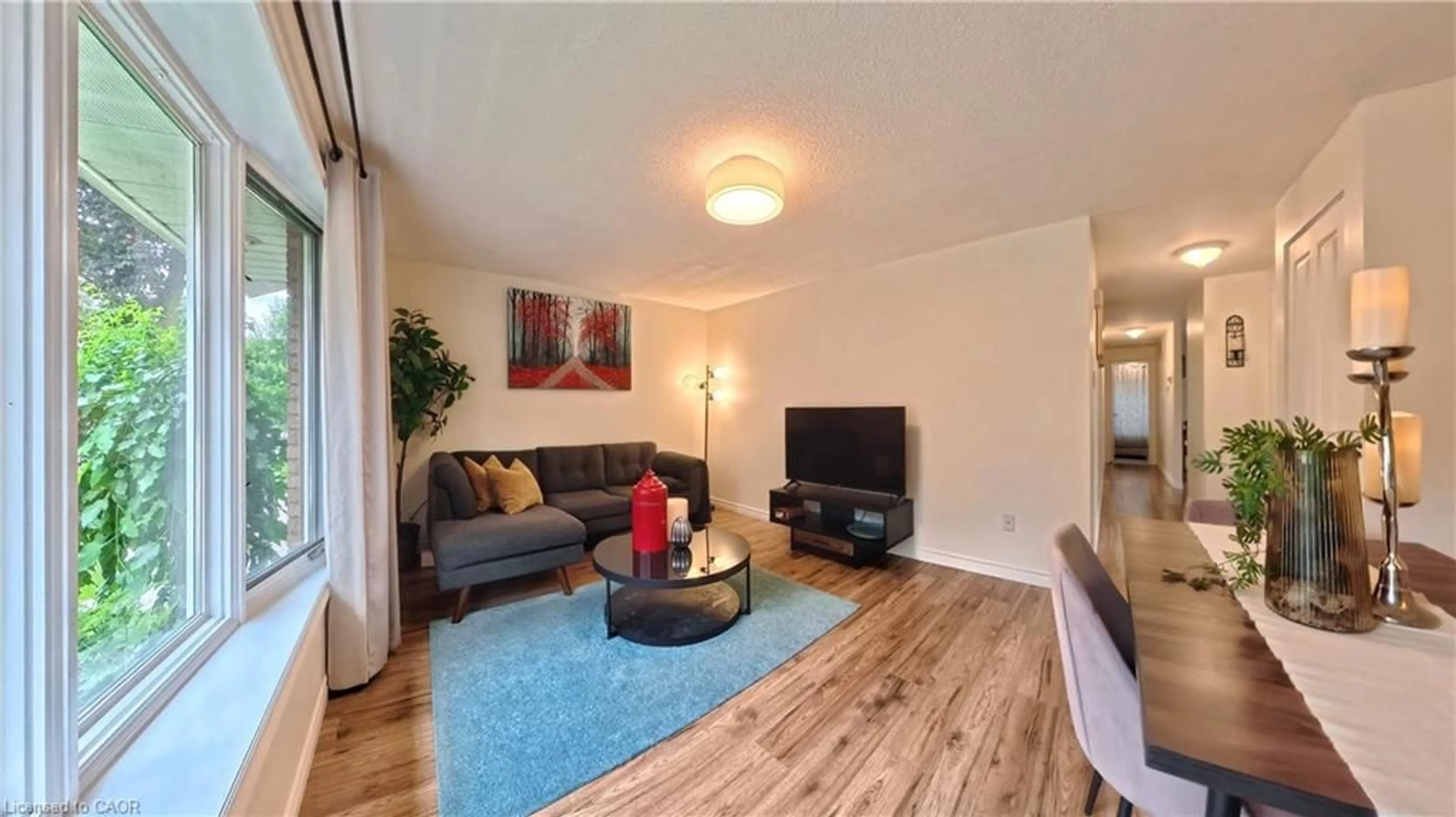 Living room with furniture, wood/laminate floor for 380 Grangewood Dr, Waterloo Ontario N2K 2E6