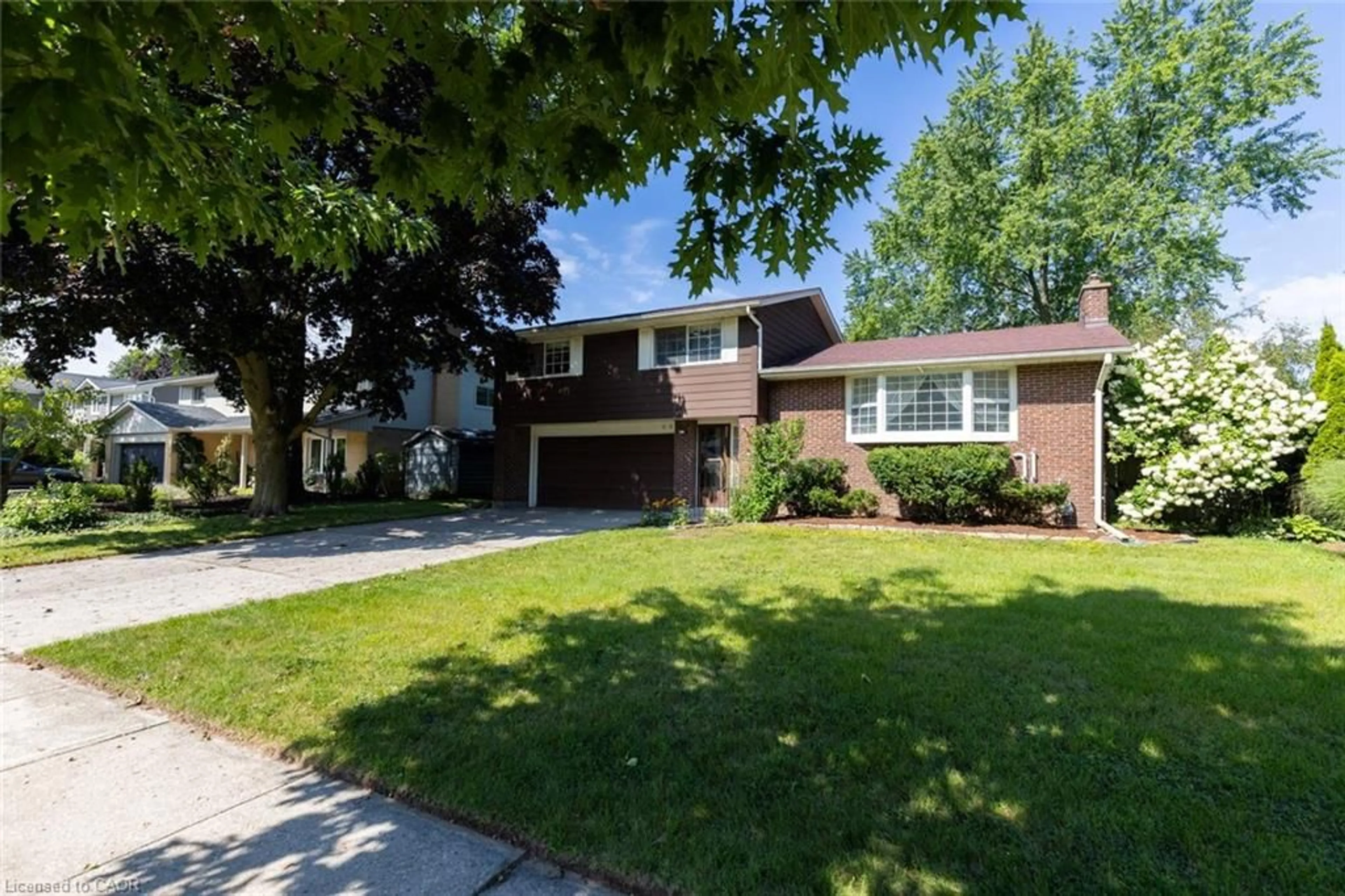 Home with brick exterior material, street for 68 Halliwell Dr, Kitchener Ontario N2B 2M3