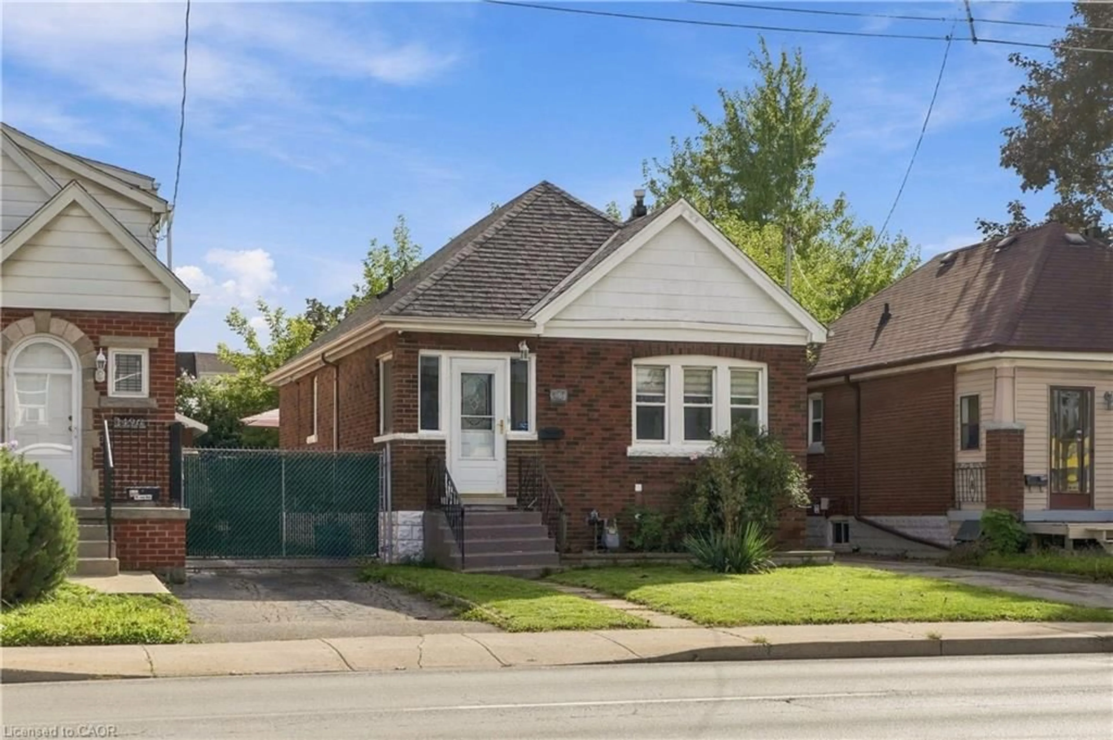 Home with brick exterior material, street for 1494 Main St, Hamilton Ontario L8K 1E1