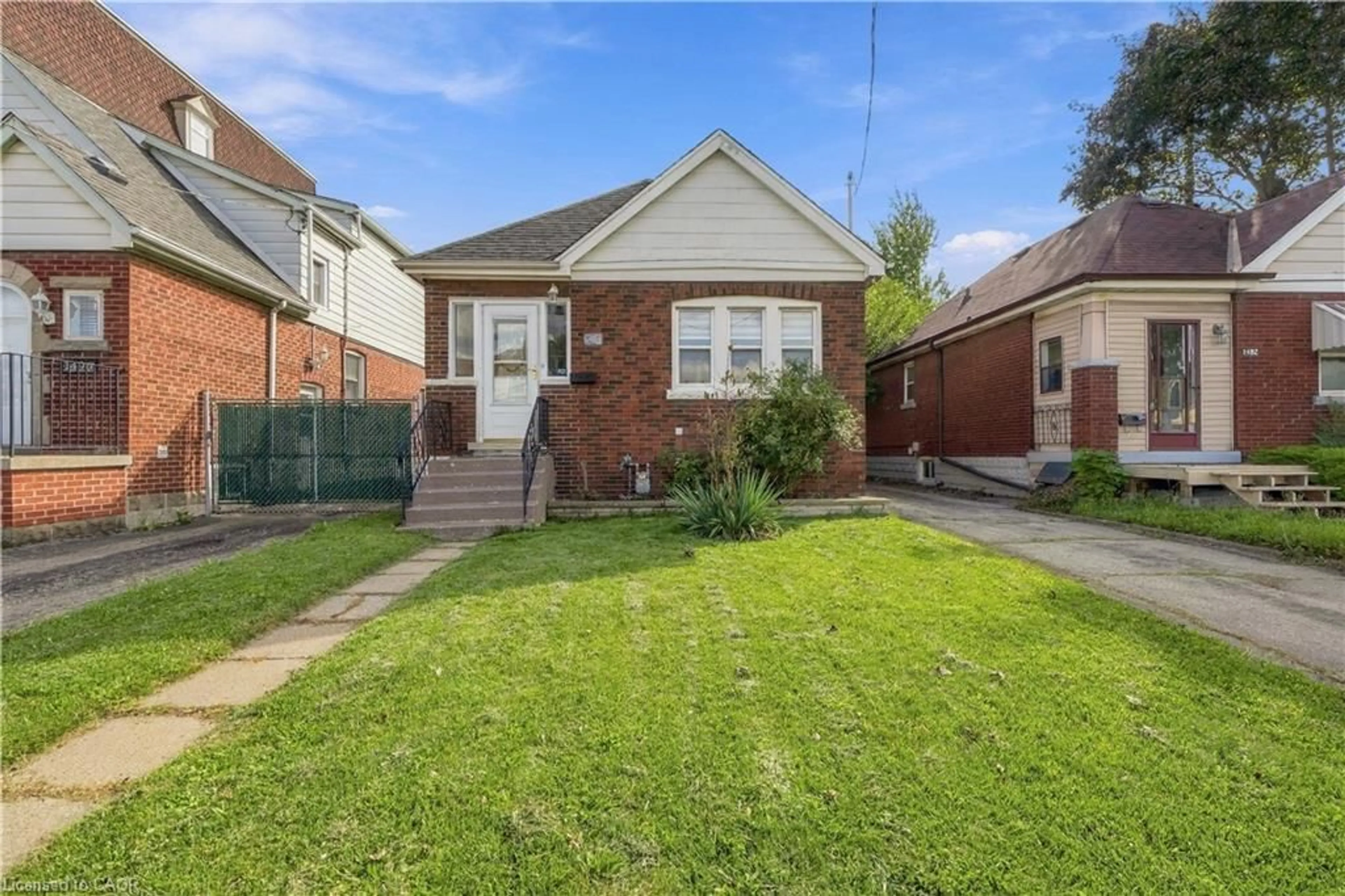 Home with brick exterior material, street for 1494 Main St, Hamilton Ontario L8K 1E1