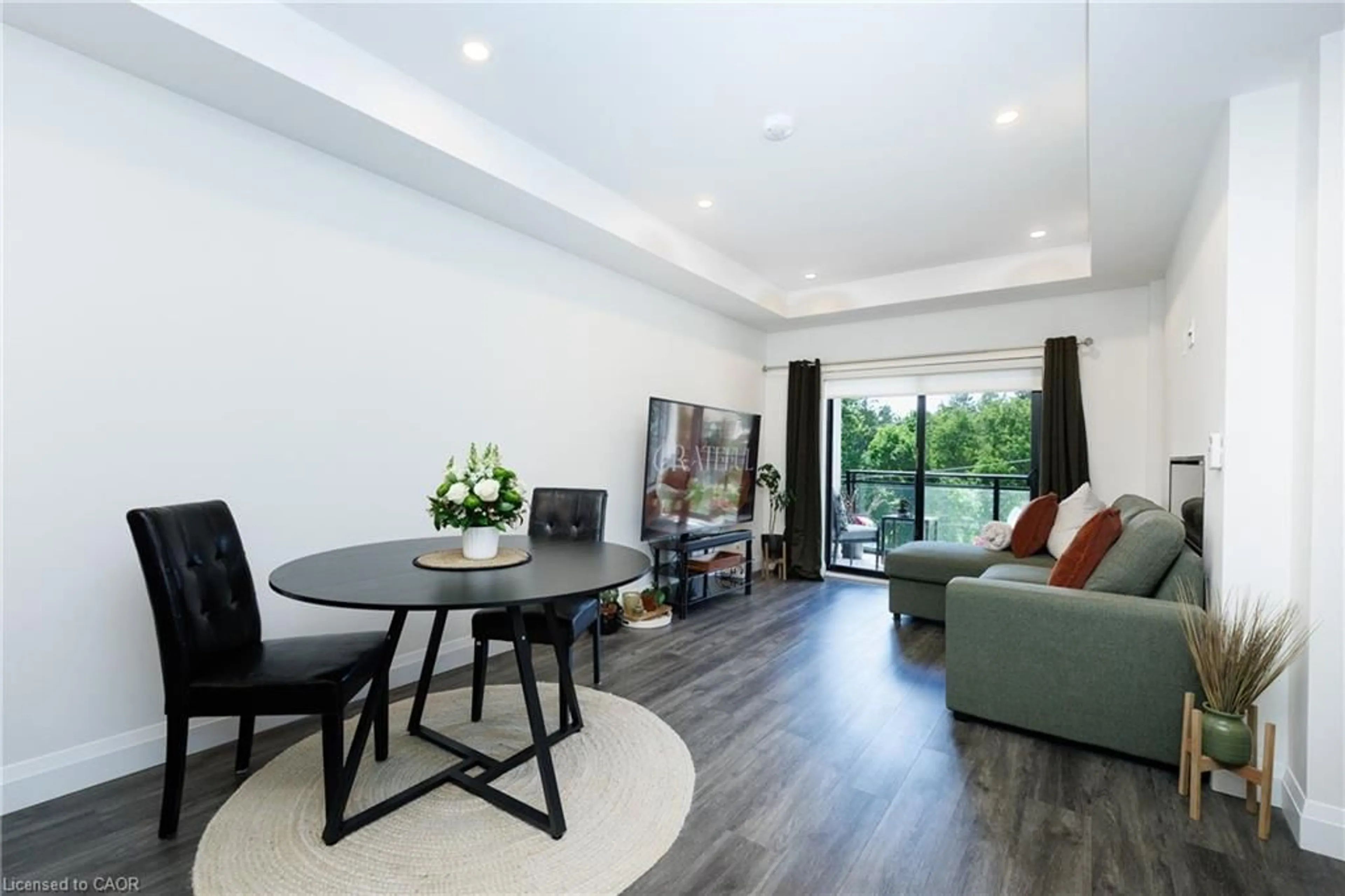 Living room with furniture, wood/laminate floor for 30 Hamilton St #201, Waterdown Ontario L8B 1V8