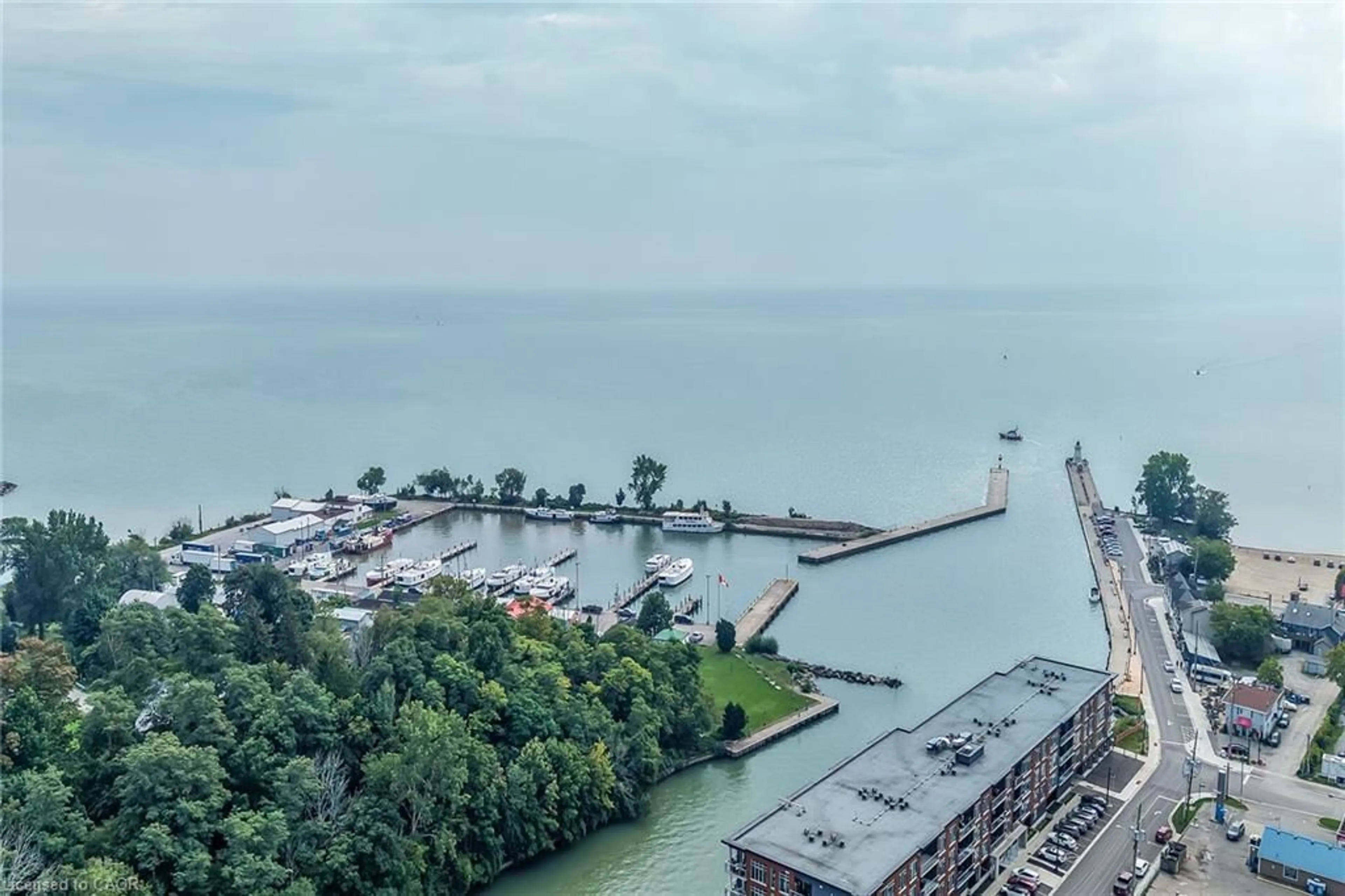 A pic from outside/outdoor area/front of a property/back of a property/a pic from drone, water/lake/river/ocean view for 38 Harbour St #304, Port Dover Ontario N0A 1N0