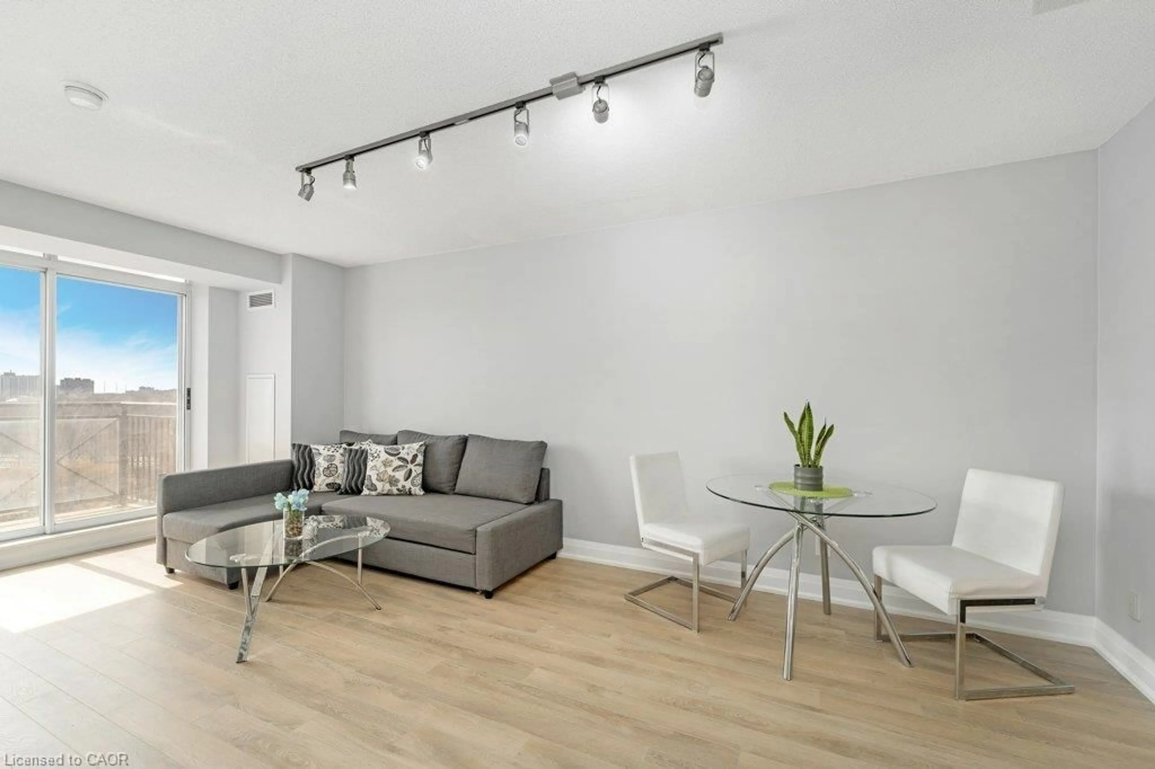 Living room with furniture, wood/laminate floor for 1103 Leslie St #701, North York Ontario M3C 4G8