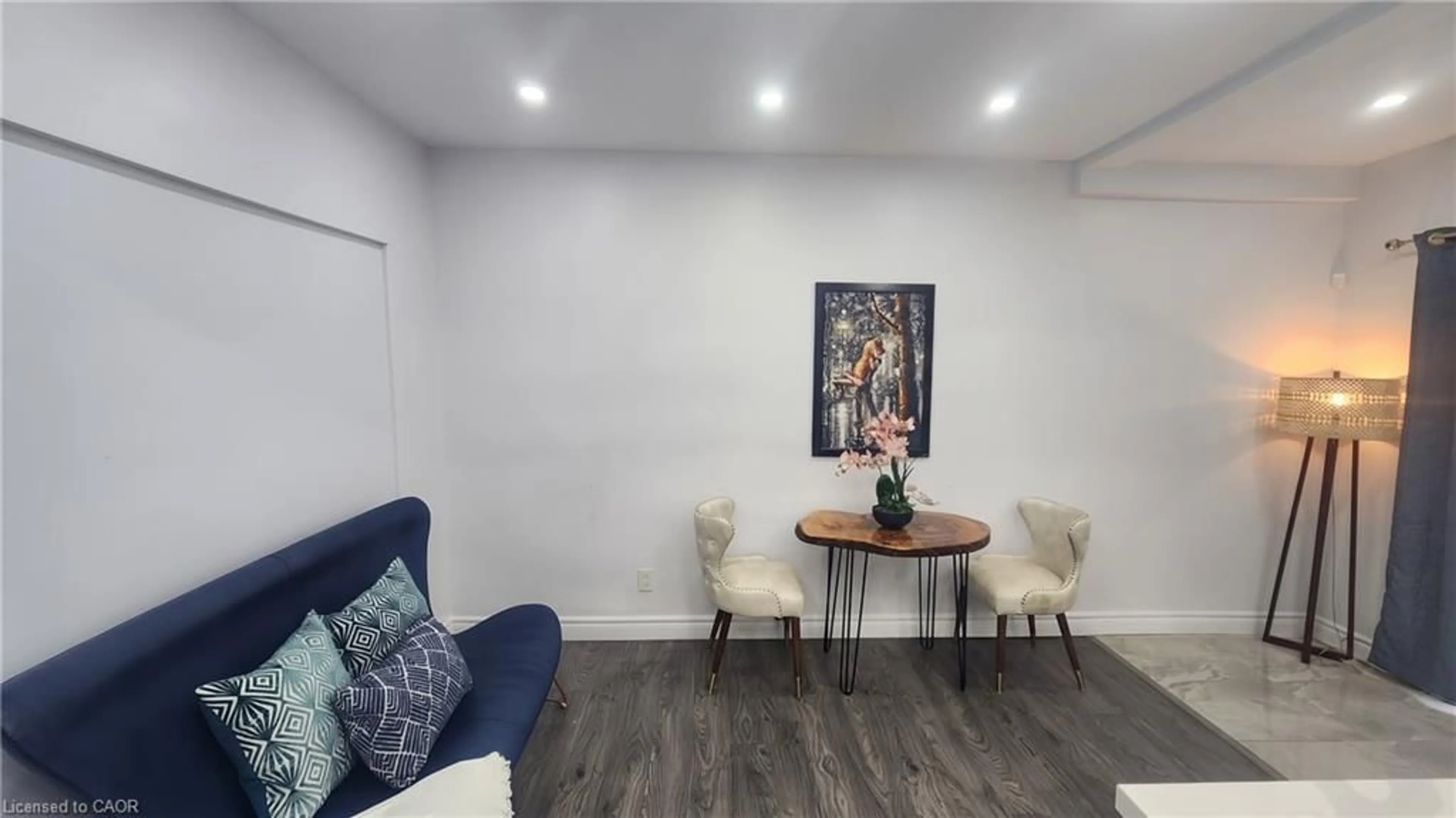 Living room with furniture, wood/laminate floor for 1394 Cannon St, Hamilton Ontario L8H 1W1