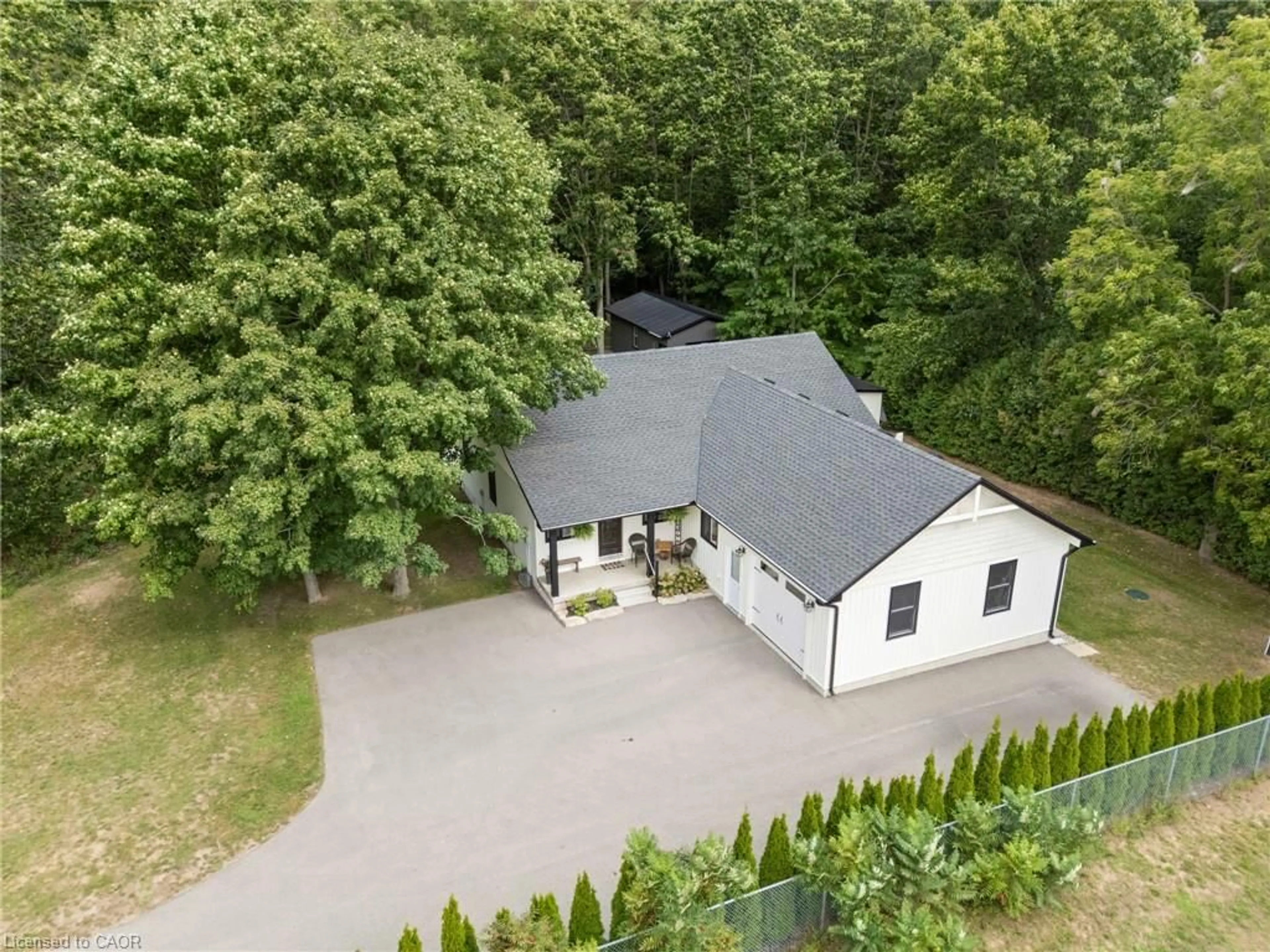 A pic from outside/outdoor area/front of a property/back of a property/a pic from drone, street for 22 Milne St, Walsingham Ontario N0E 1X0