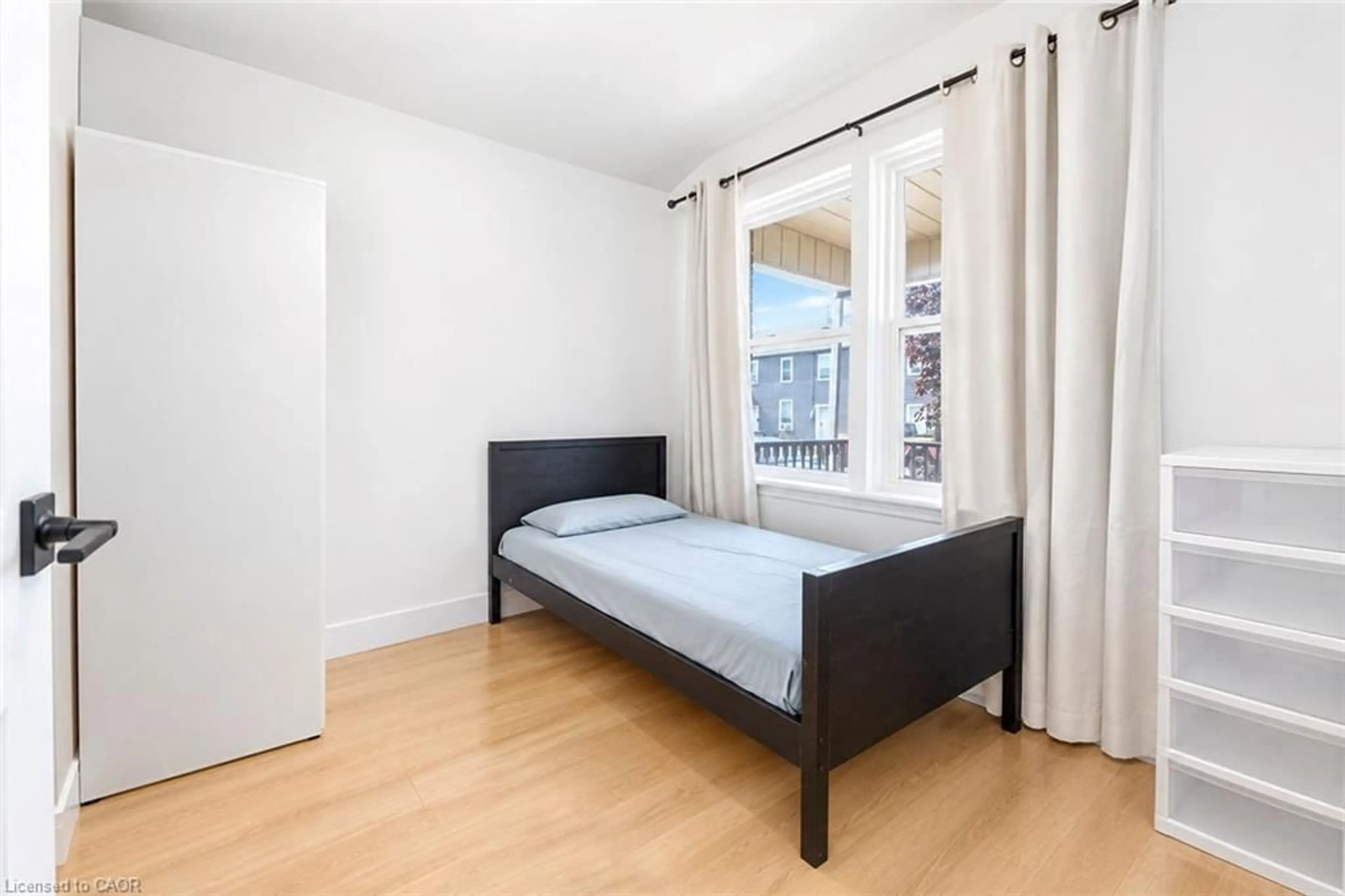 Bedroom with bed, wood/laminate floor for 177 George St, Brantford Ontario N3T 2Z2