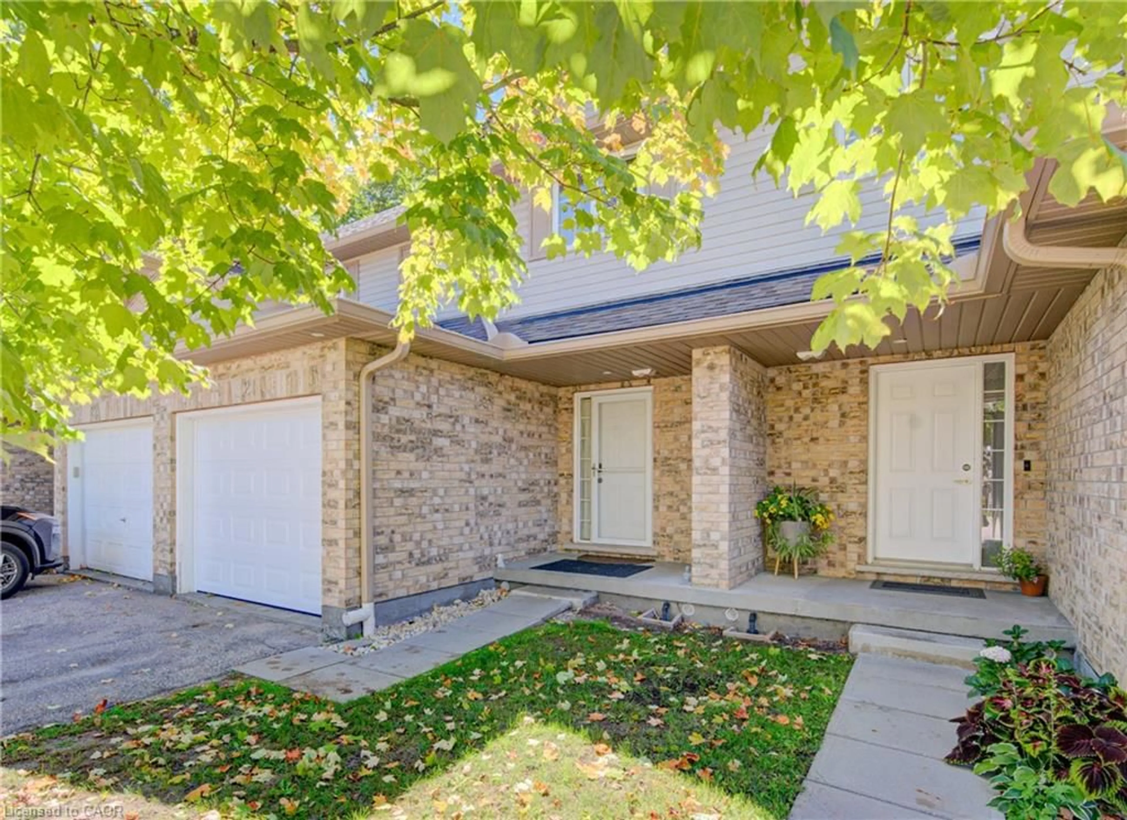 Home with brick exterior material, street for 300 Fallowfield Dr #21, Kitchener Ontario N2C 0A9
