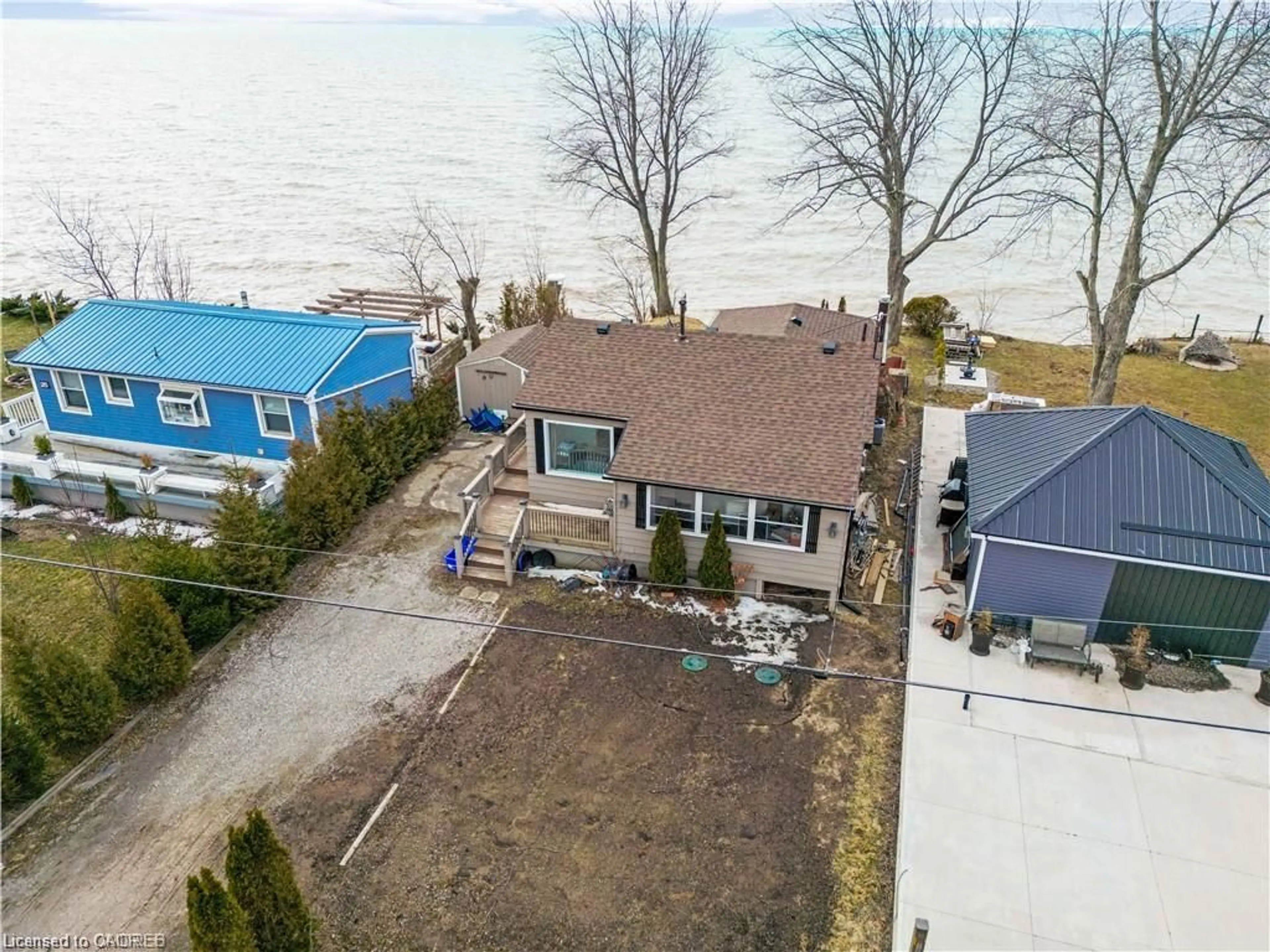 A pic from outside/outdoor area/front of a property/back of a property/a pic from drone, water/lake/river/ocean view for 27 Villella Rd, Lowbanks Ontario N0A 1K0