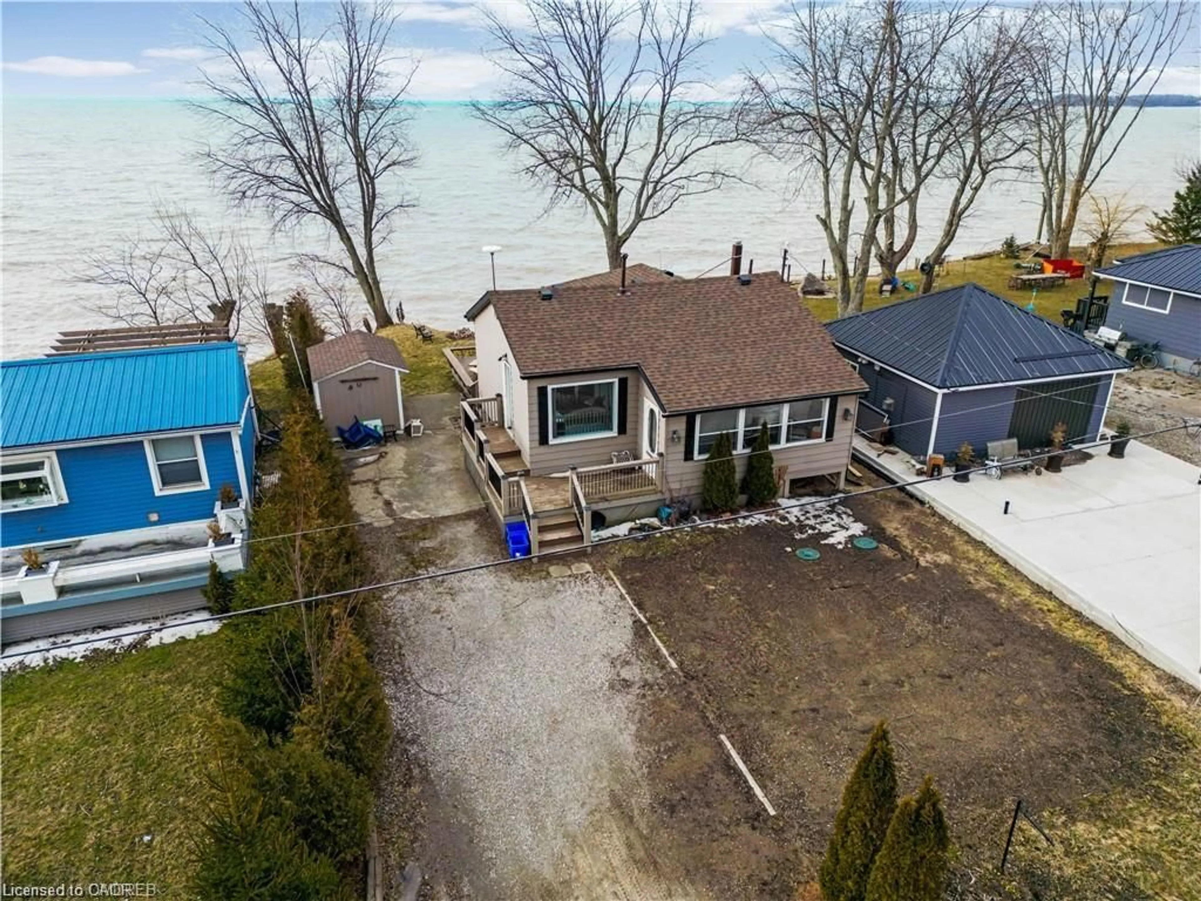 A pic from outside/outdoor area/front of a property/back of a property/a pic from drone, water/lake/river/ocean view for 27 Villella Rd, Lowbanks Ontario N0A 1K0
