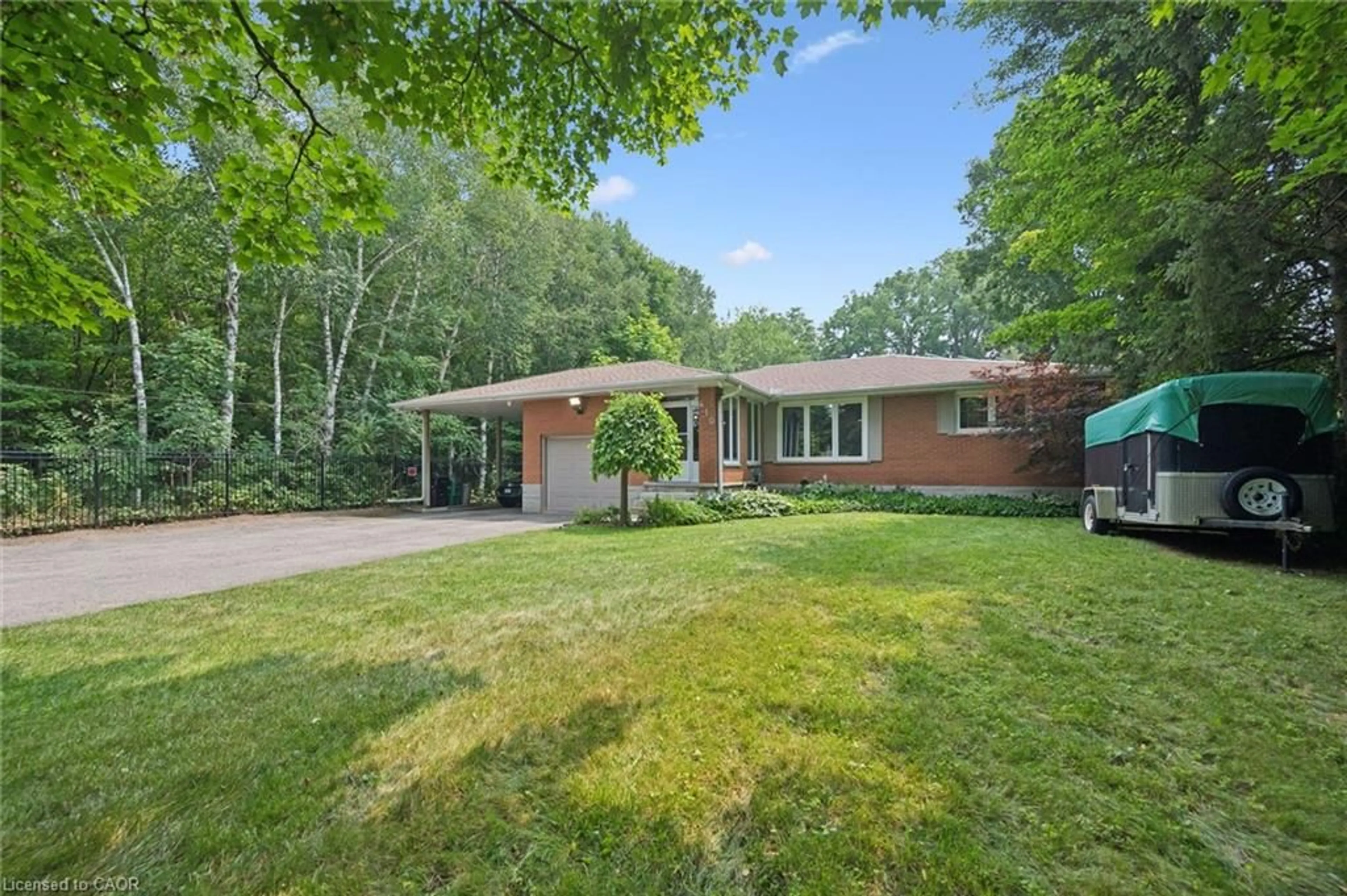 Home with brick exterior material, forest/trees view for 410 Avenue Rd, Cambridge Ontario N1R 5S4