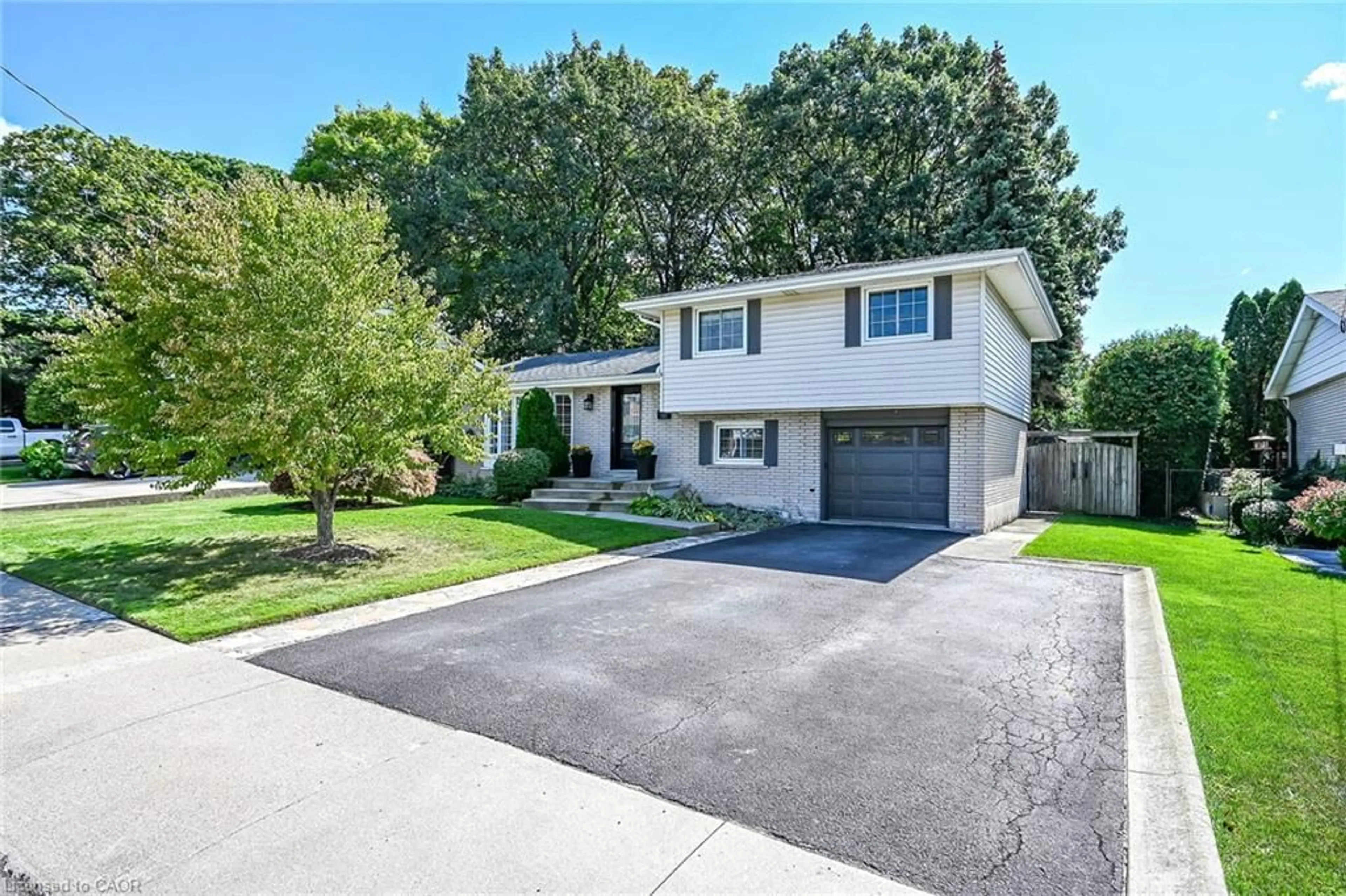 Home with vinyl exterior material, street for 48 Margate Ave, Hamilton Ontario L8T 1M8