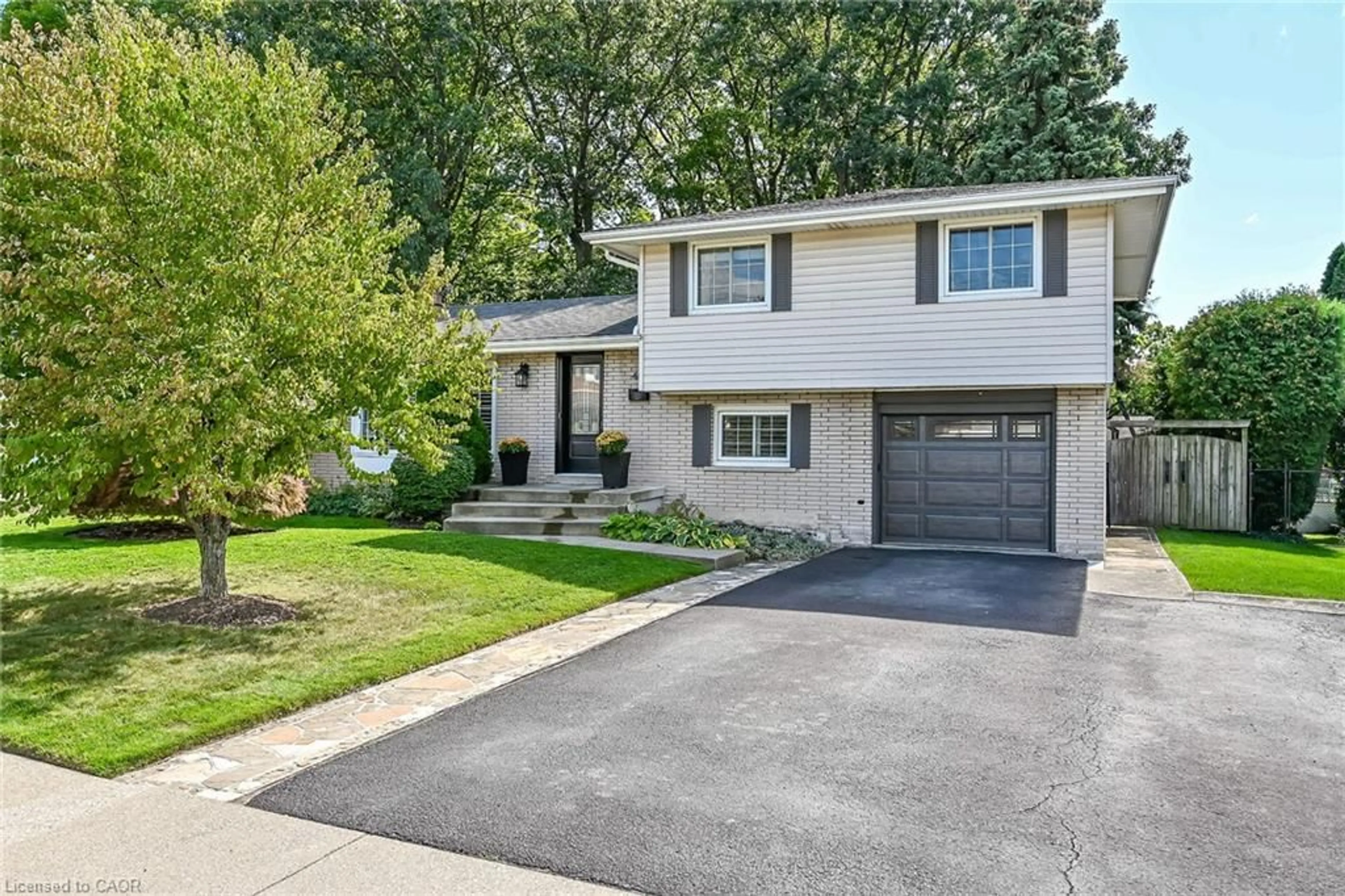 Home with vinyl exterior material, street for 48 Margate Ave, Hamilton Ontario L8T 1M8