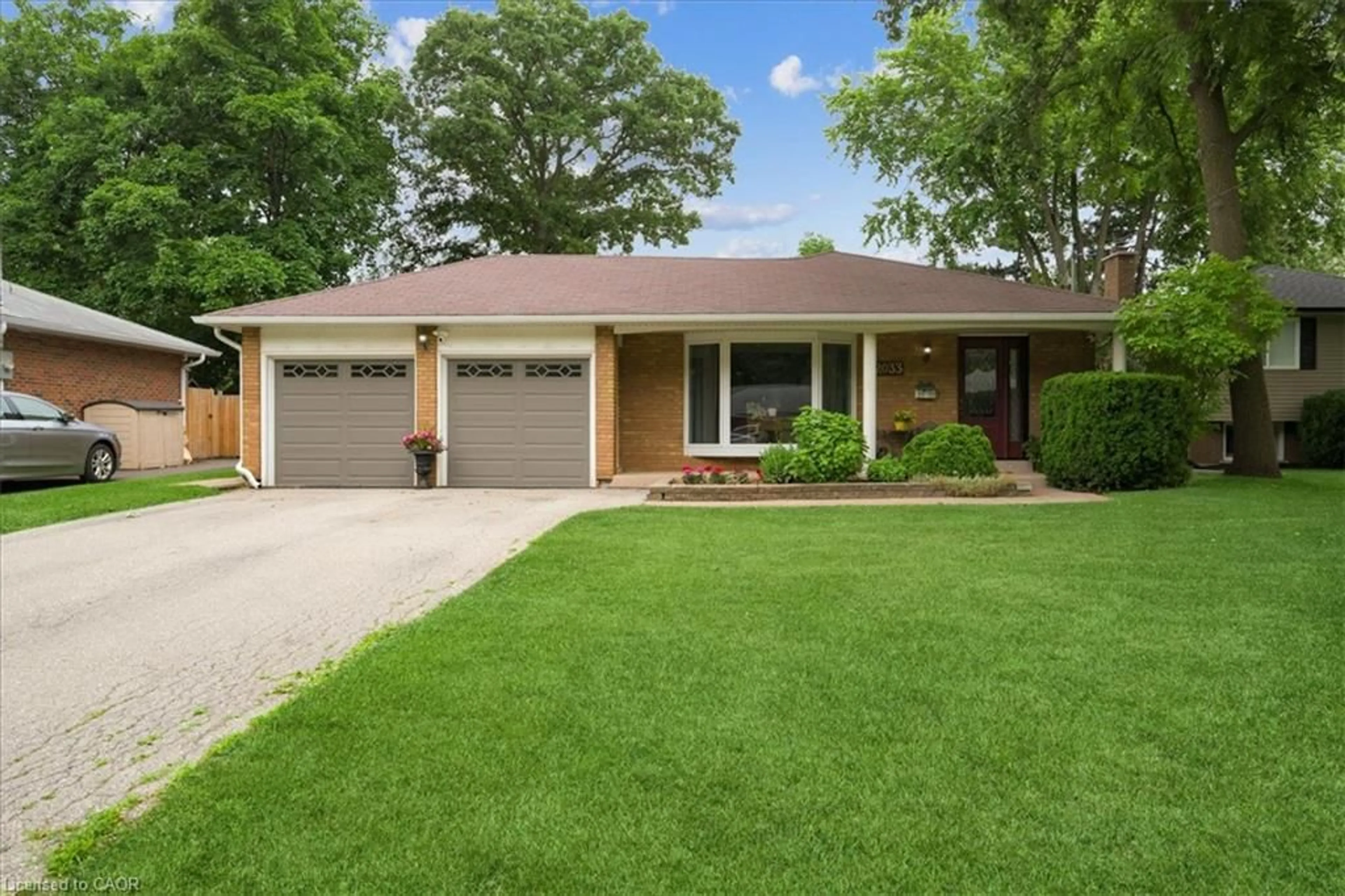 Home with brick exterior material, street for 2033 Saxon Rd, Oakville Ontario L6L 2V1