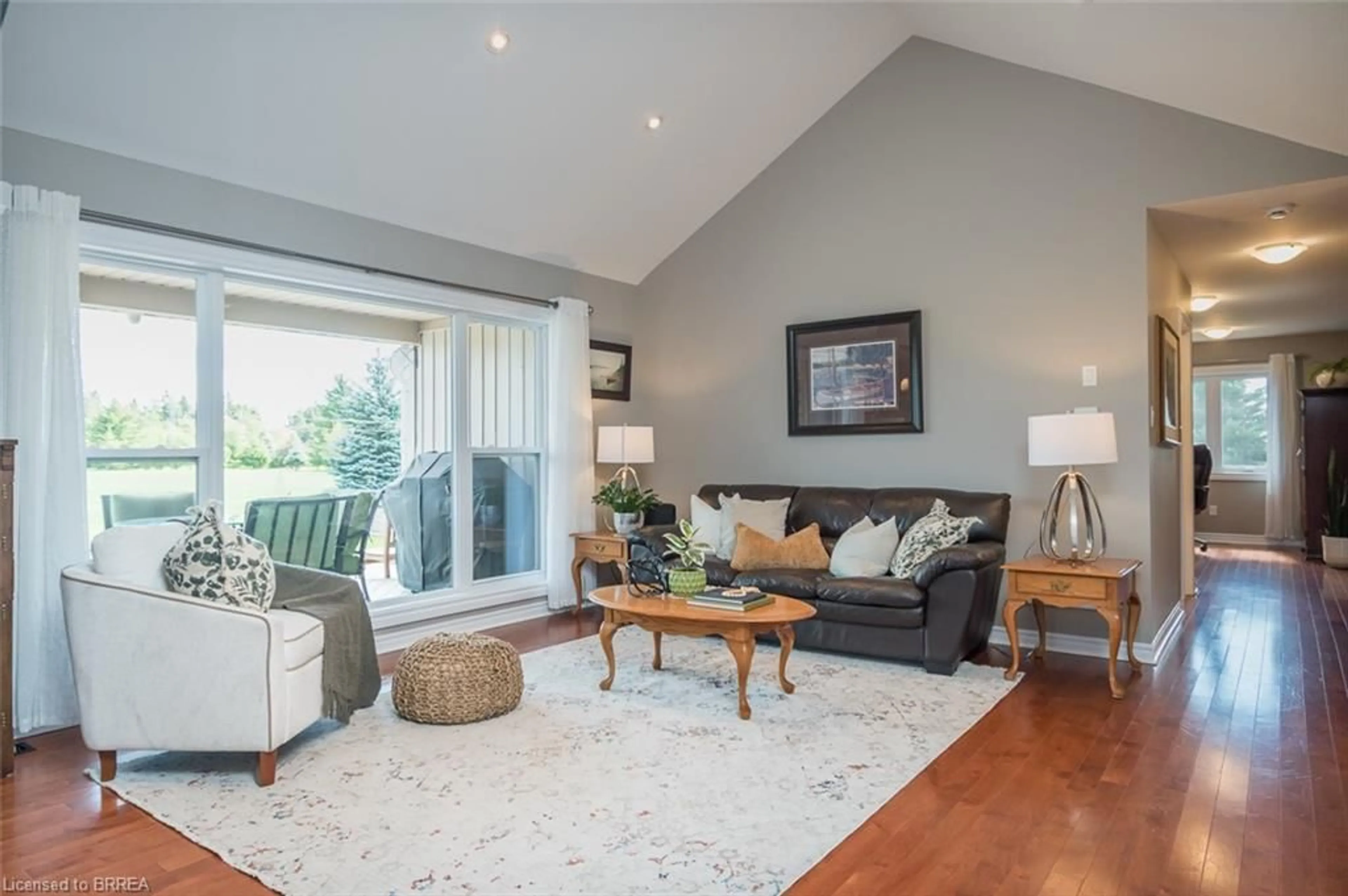 Living room with furniture, wood/laminate floor for 15 Mount Haven Cres, Grand Valley Ontario L9W 5Y9
