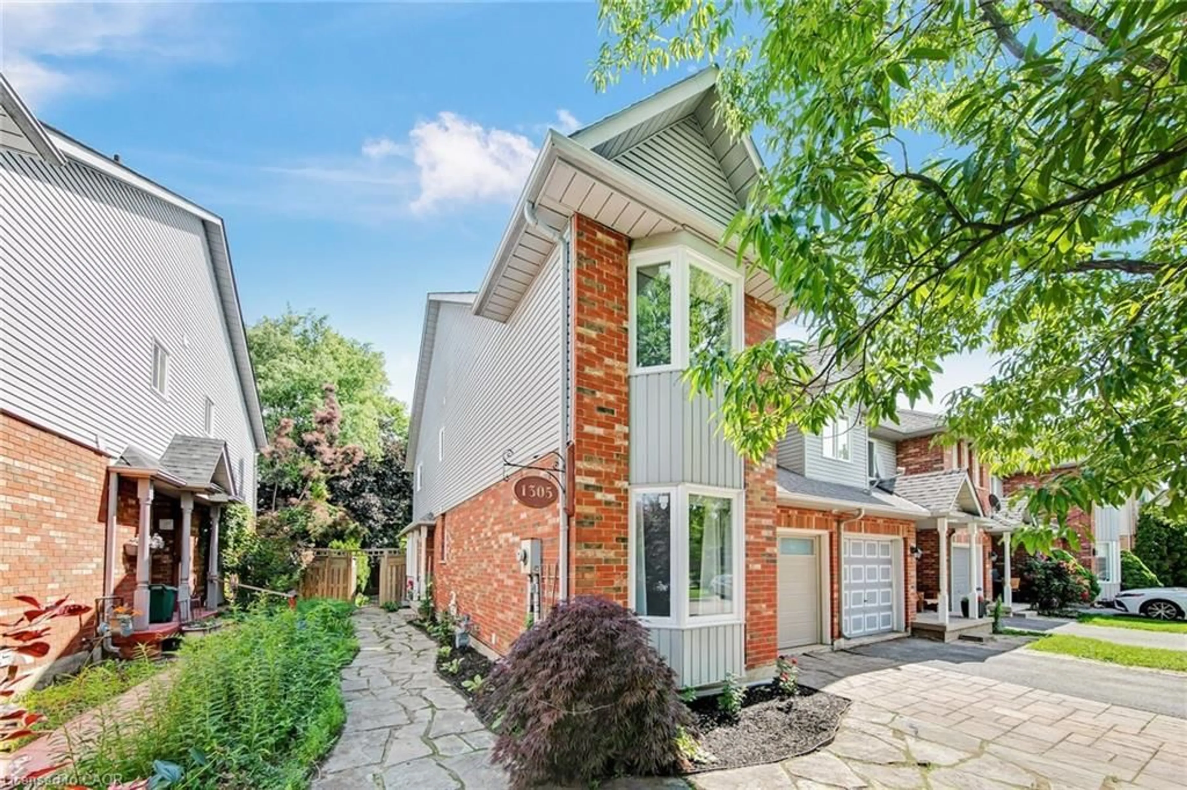 Home with brick exterior material, street for 1305 Walker's Line, Burlington Ontario L7M 4N7
