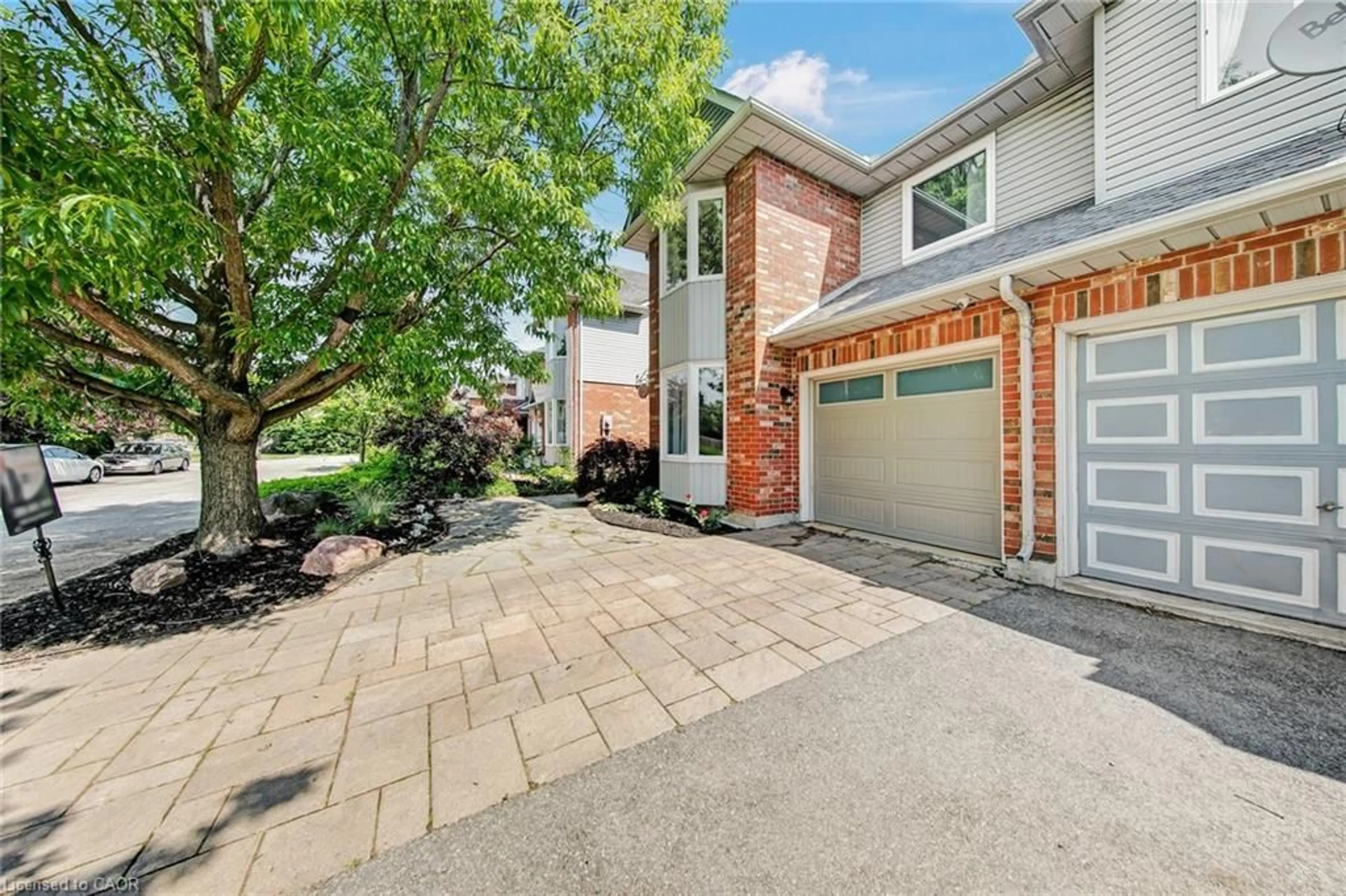 Home with brick exterior material, street for 1305 Walker's Line, Burlington Ontario L7M 4N7