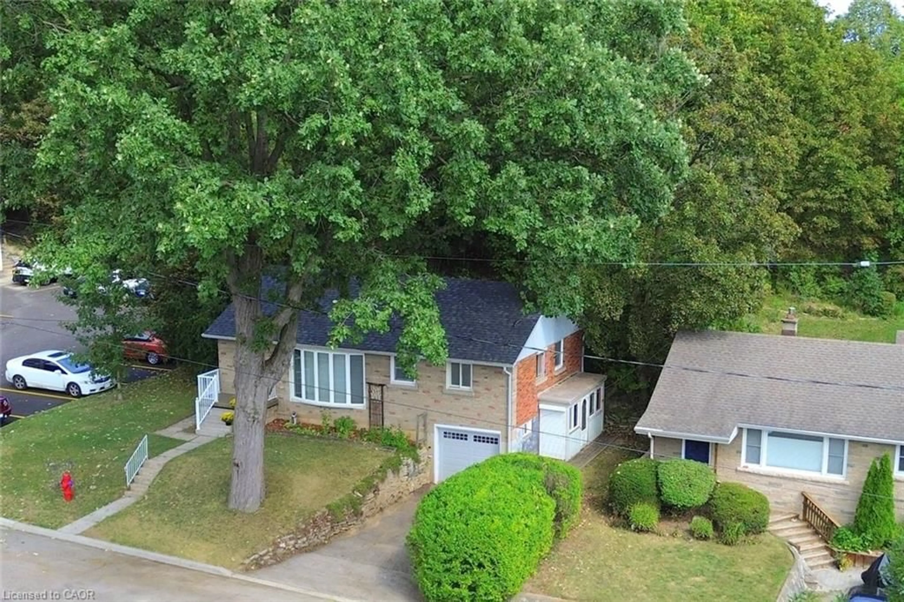 A pic from outside/outdoor area/front of a property/back of a property/a pic from drone, street for 24 Delsey St, Dundas Ontario L9H 1S1