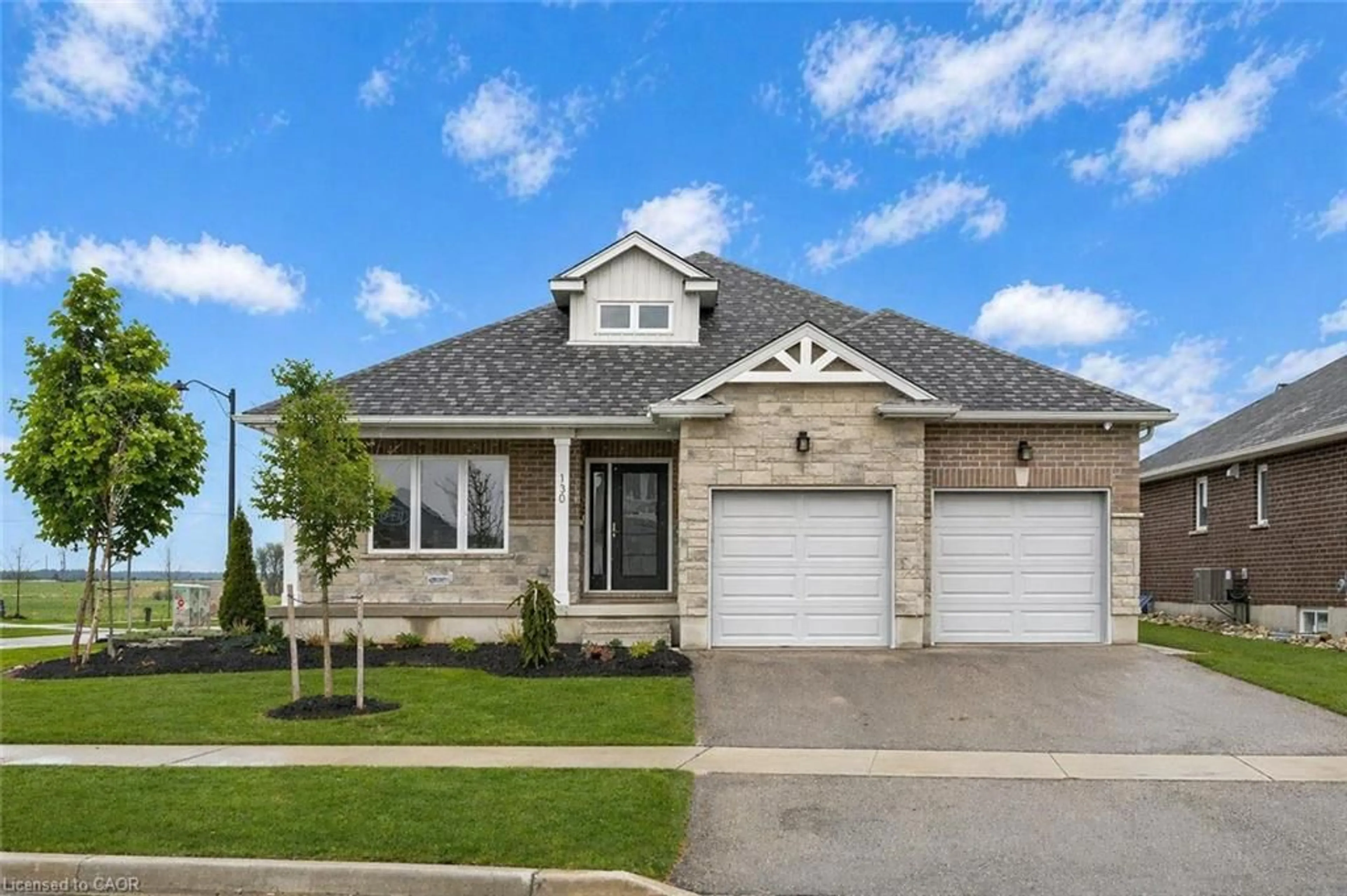 Home with brick exterior material, street for 130 Stephenson Way, Minto Ontario N0G 2P0
