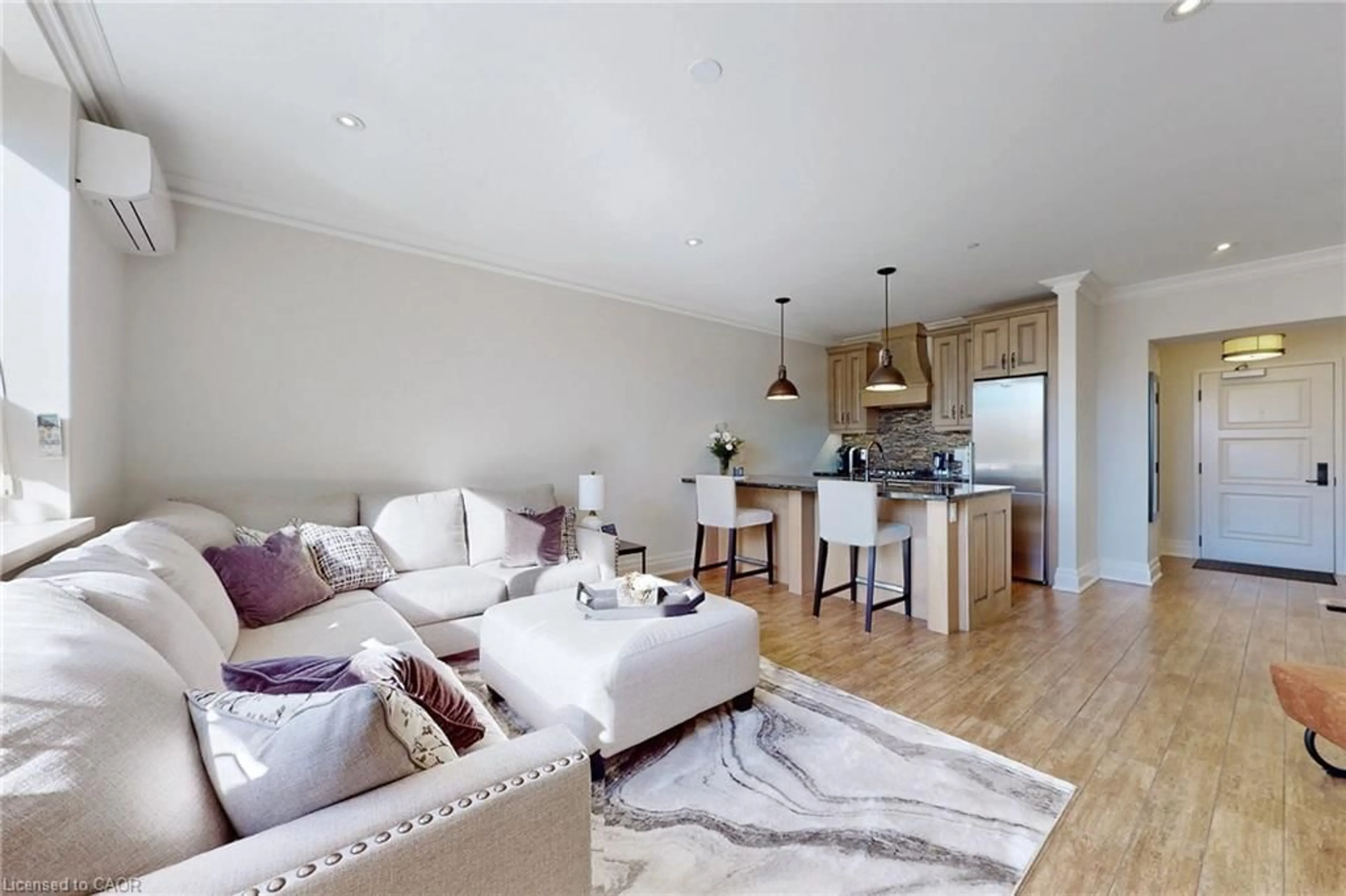 Living room with furniture, wood/laminate floor for 397 King St #108, Dundas Ontario L9H 1W9