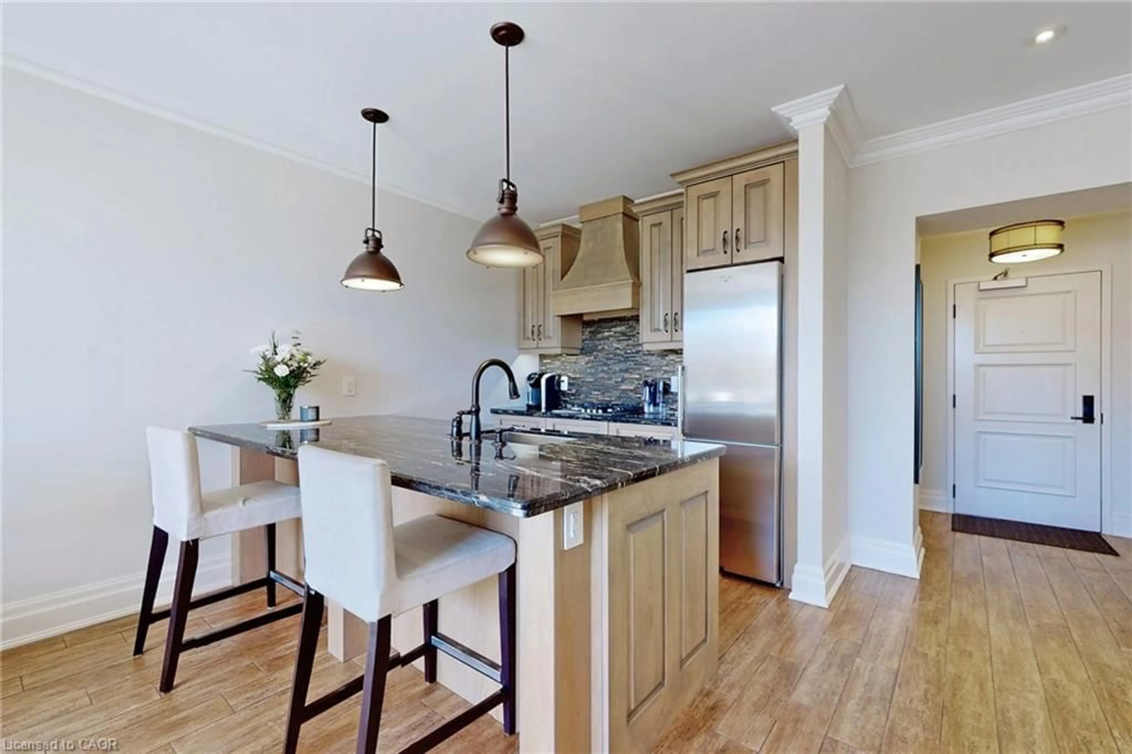 Open concept kitchen, wood/laminate floor for 397 King St #108, Dundas Ontario L9H 1W9