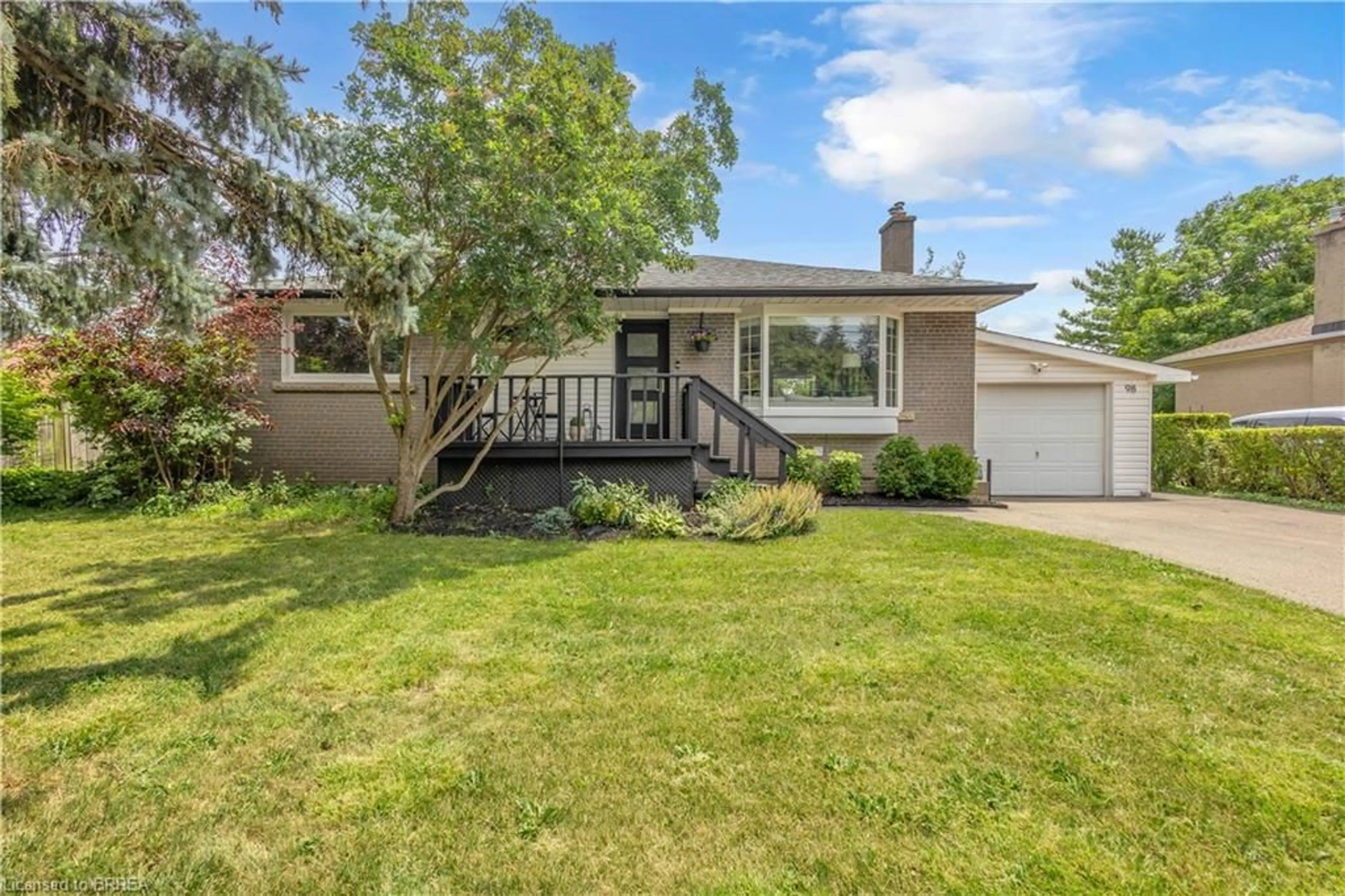Home with vinyl exterior material, street for 98 Miller Rd, Oakville Ontario L6H 1J9