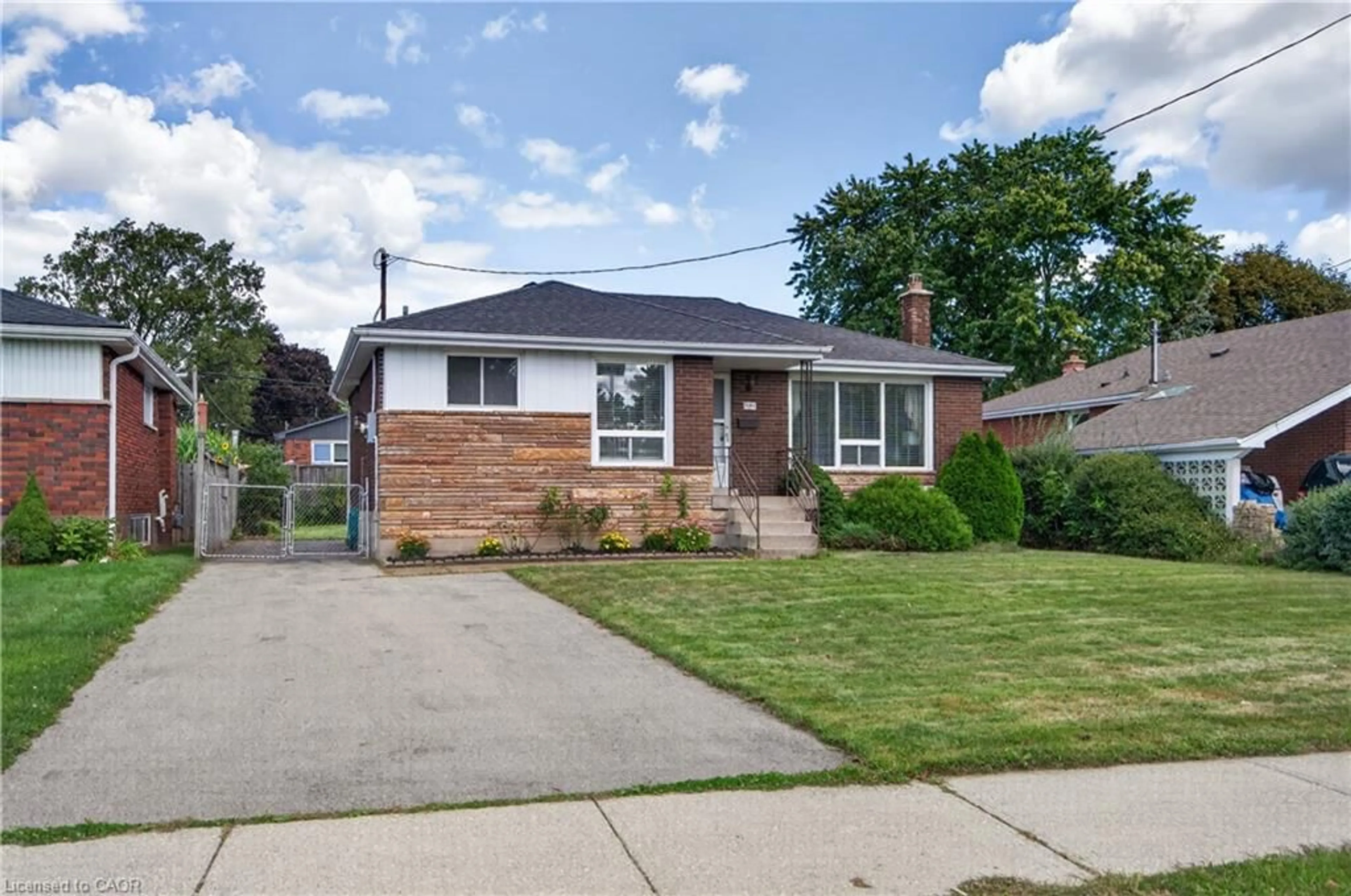 Home with brick exterior material, street for 1101 Mohawk Rd, Hamilton Ontario L8T 2S4