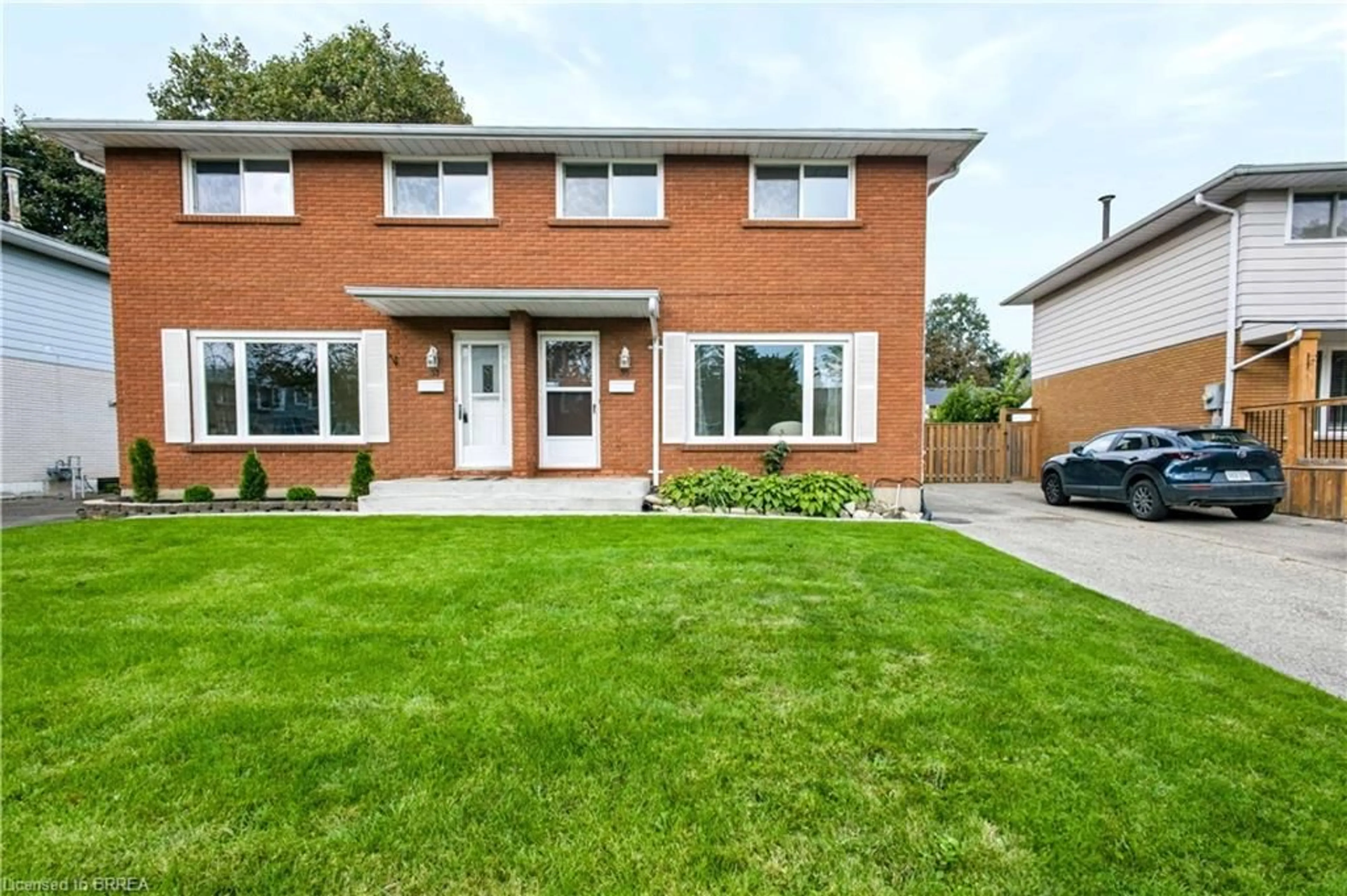 Home with brick exterior material, street for 35 Coachwood Rd, Brantford Ontario N3R 3R5