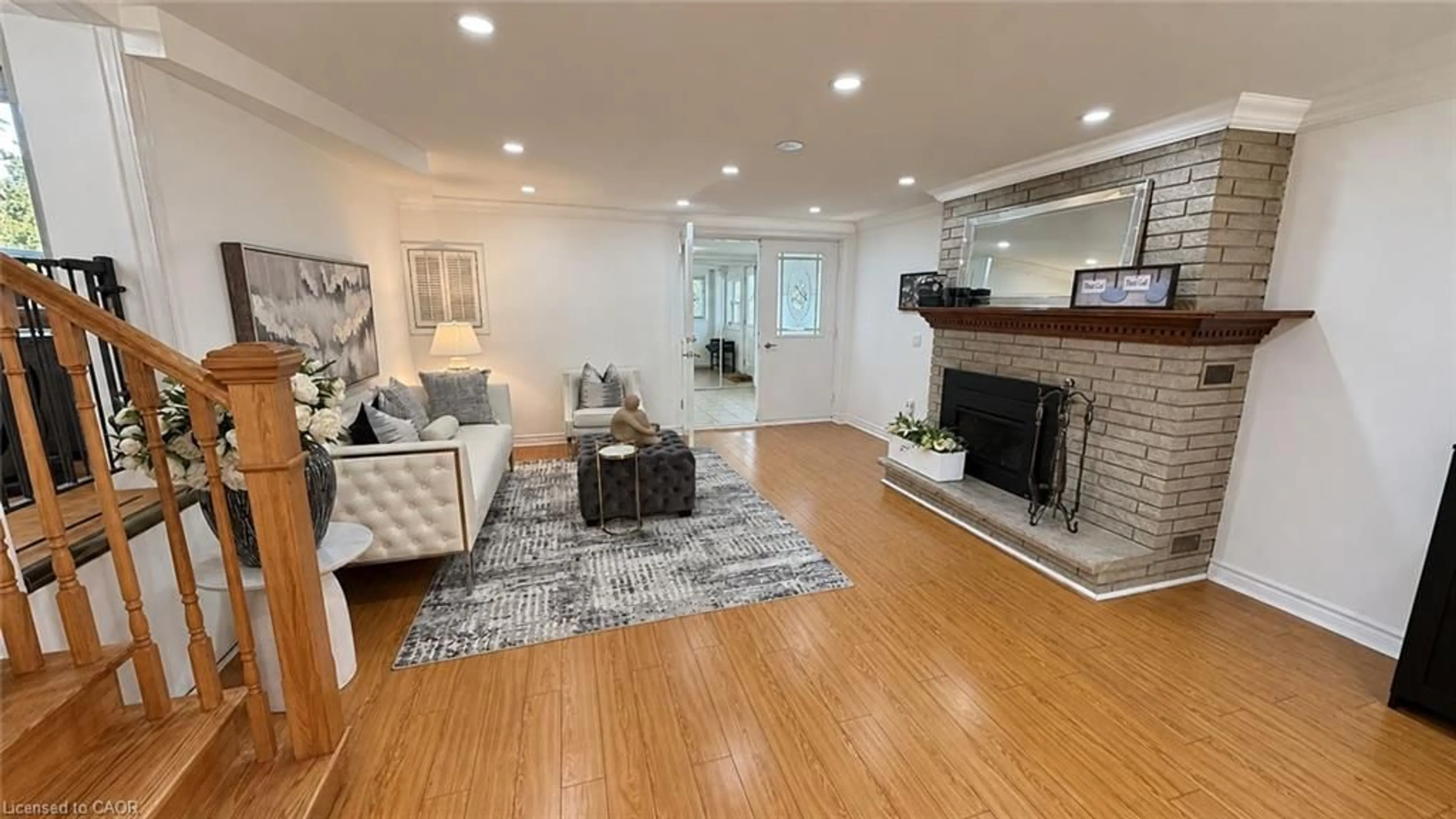 Living room with furniture, wood/laminate floor for 1369 Ravenshoe Rd, Queensville Ontario L0G 1R0
