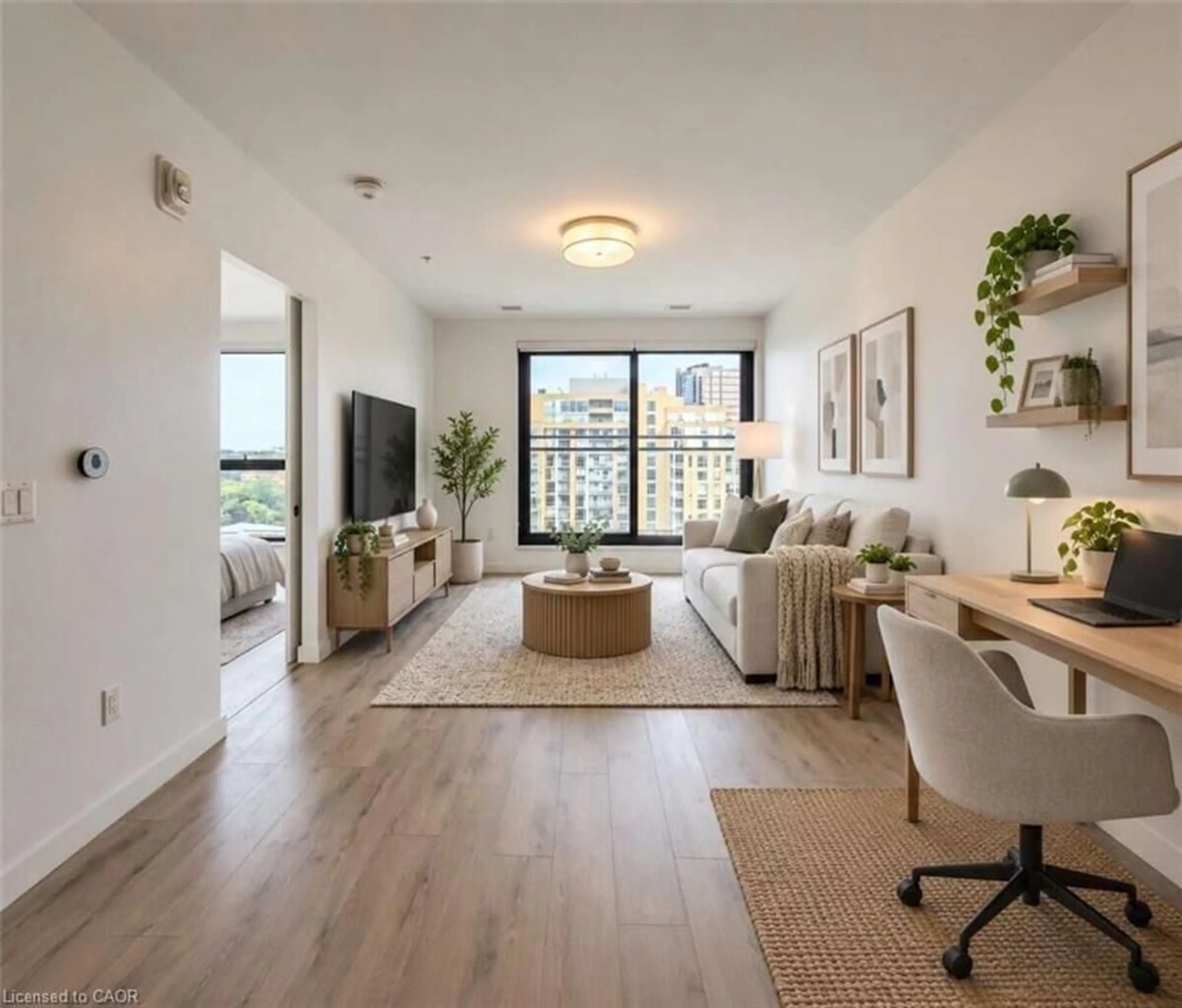Living room with furniture, wood/laminate floor for 181 King St #1212, Waterloo Ontario N2J 1P7