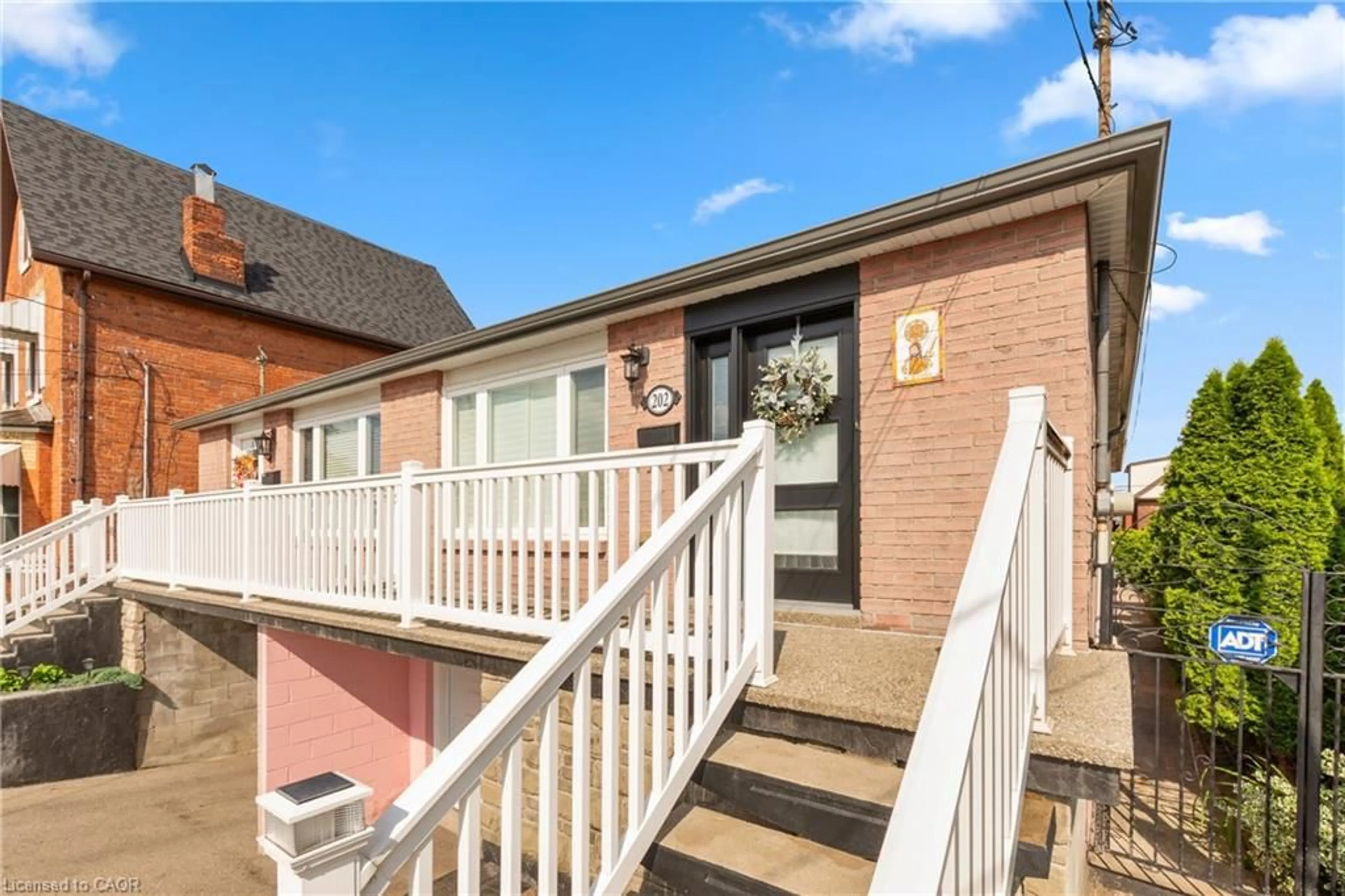Home with brick exterior material, street for 202 Ray St, Hamilton Ontario L8R 2Y2