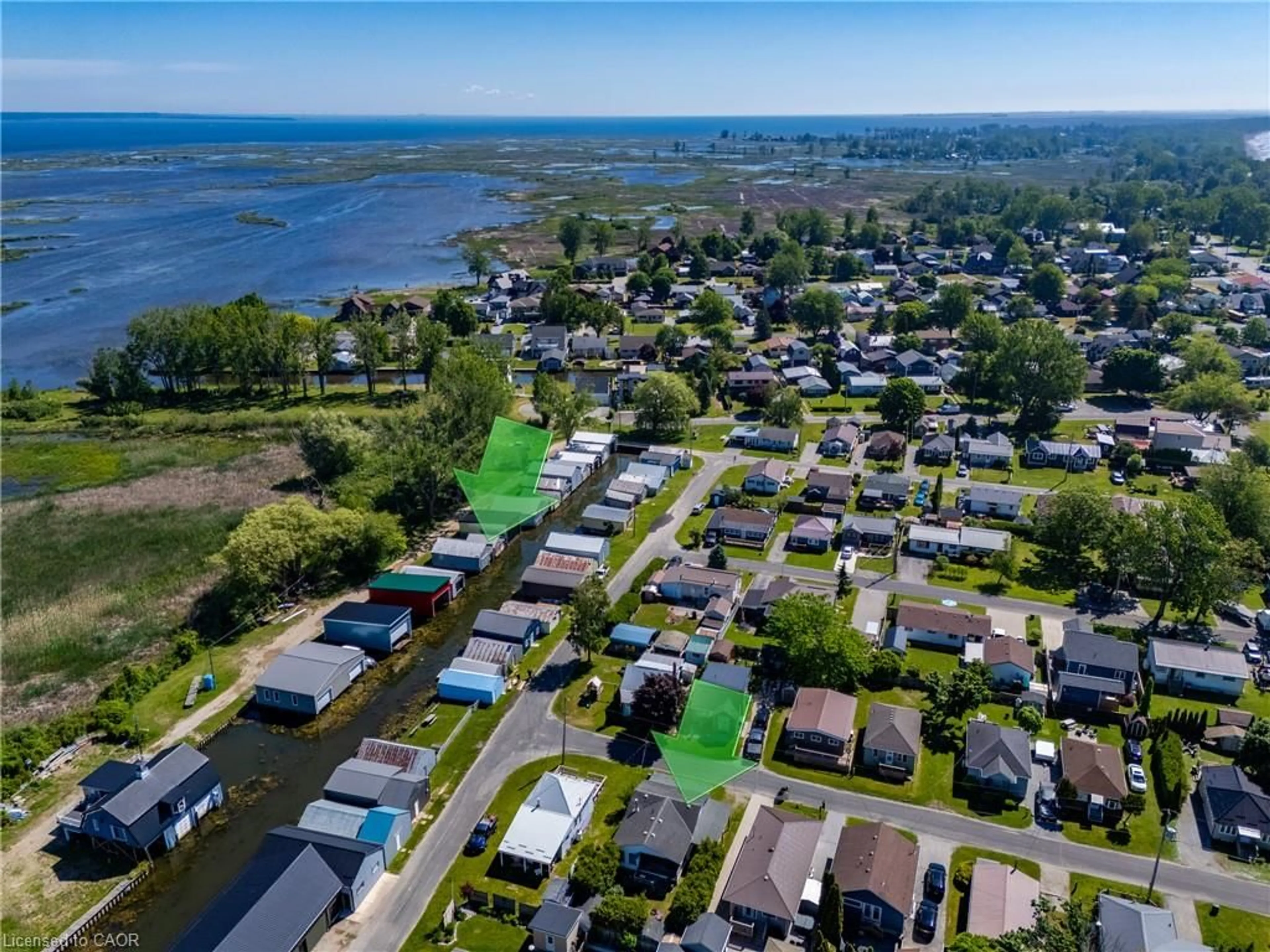 A pic from outside/outdoor area/front of a property/back of a property/a pic from drone, water/lake/river/ocean view for 22 Bass Lane, Port Rowan Ontario N0E 1M0