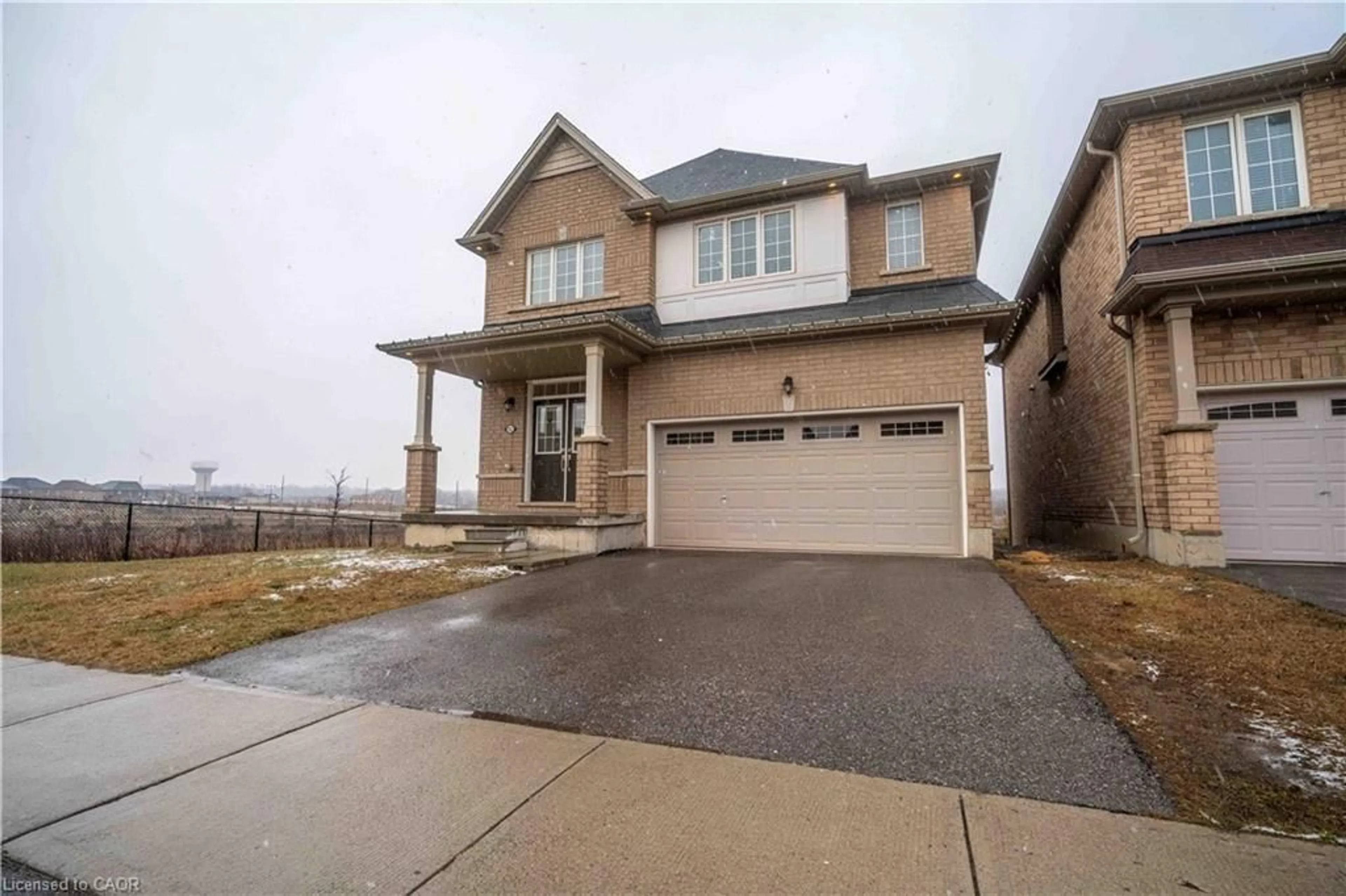 Home with brick exterior material, street for 92 Longboat Run, Brantford Ontario N3T 0P9