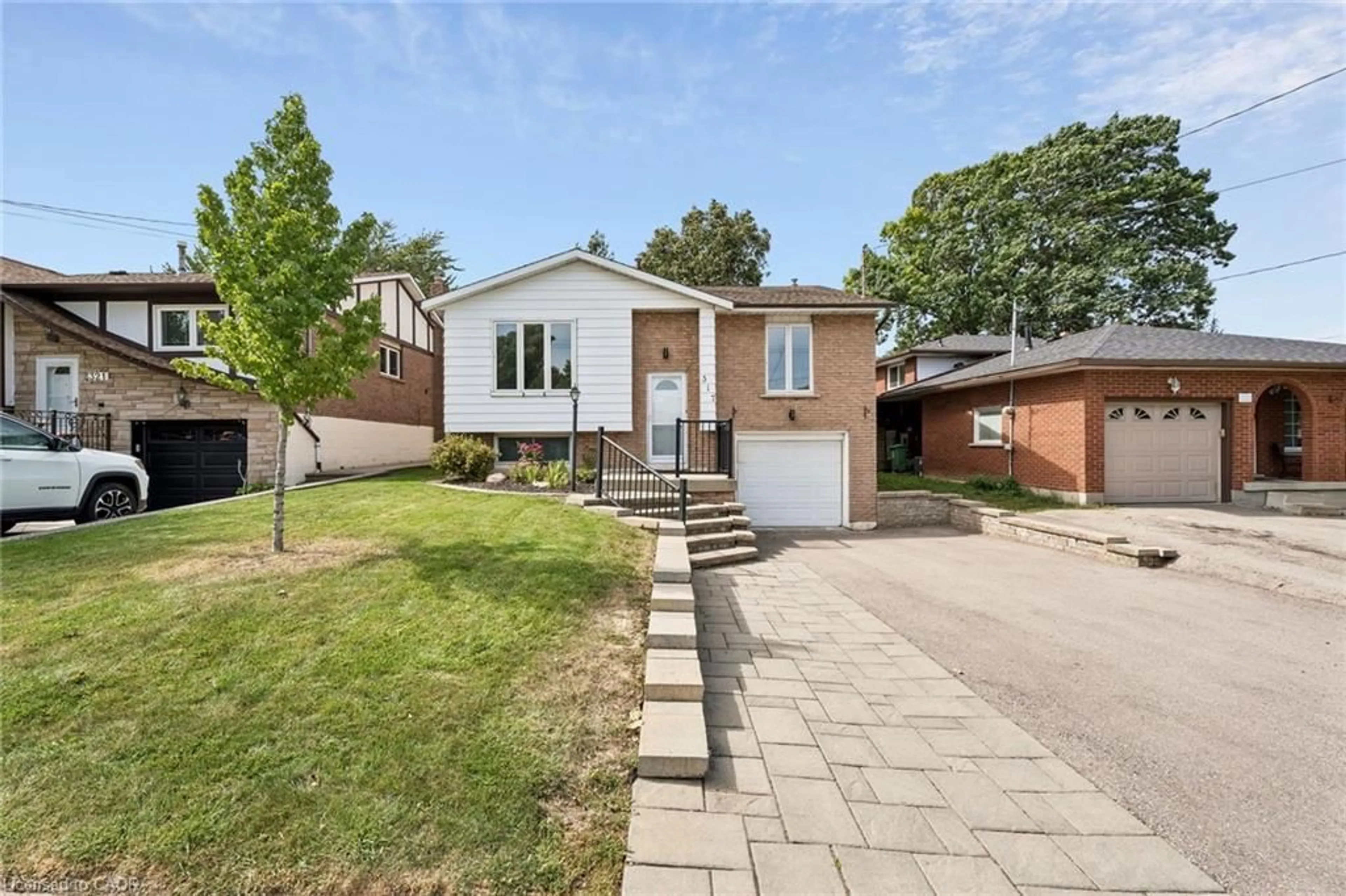 Home with brick exterior material, street for 317 Rexford Dr, Hamilton Ontario L8W 1W2