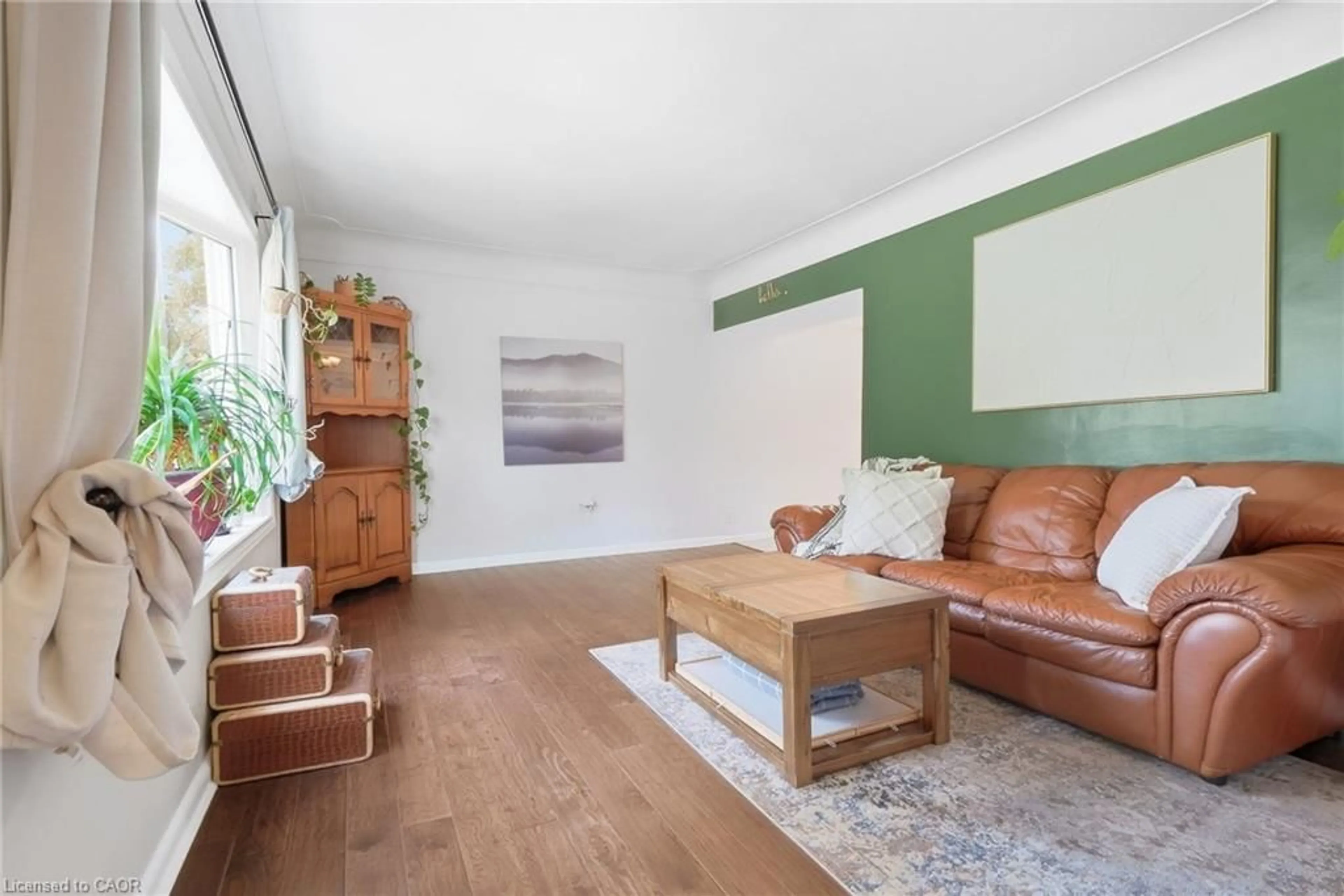Living room with furniture, wood/laminate floor for 470 Cochrane Rd, Hamilton Ontario L8K 3H1