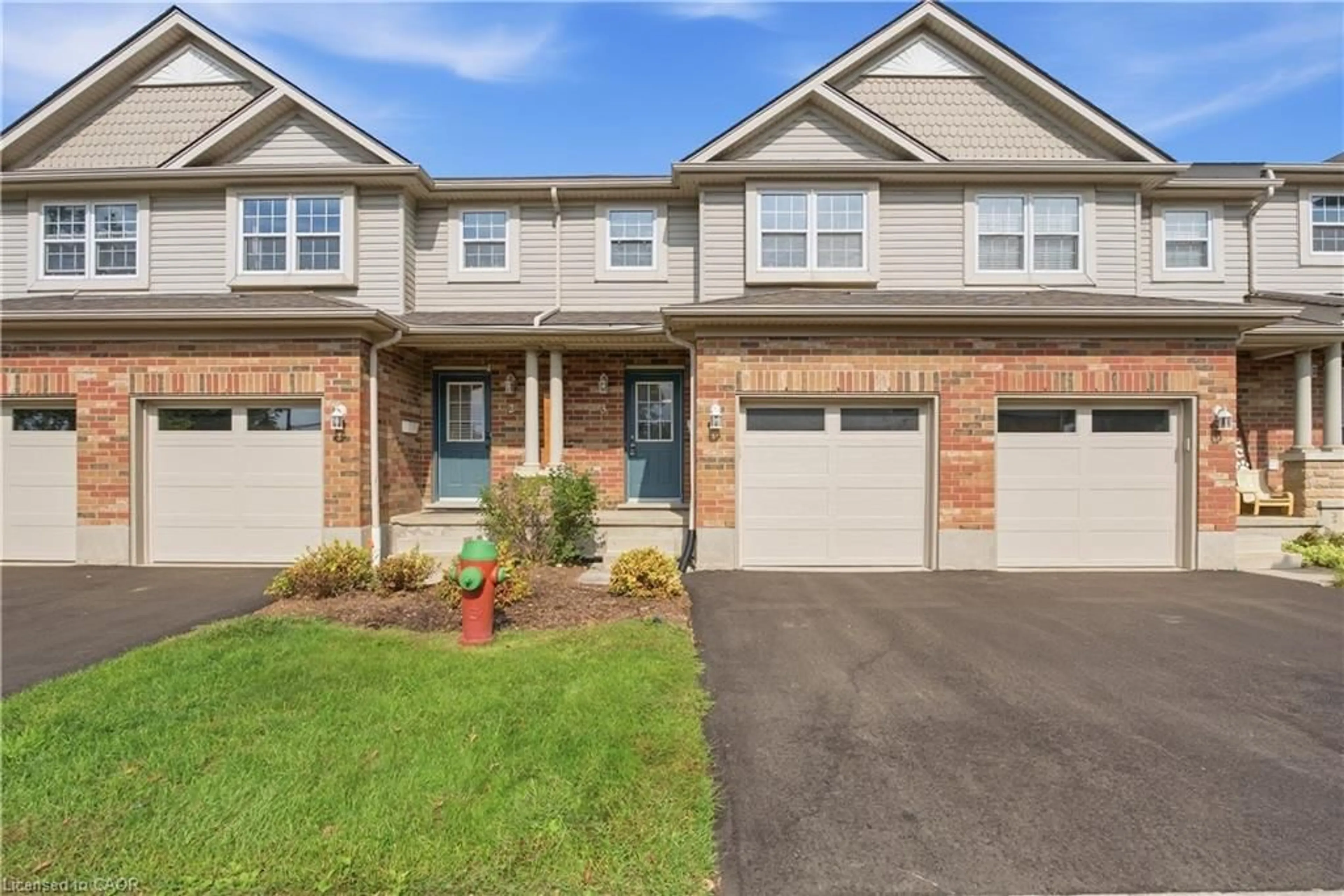 Home with brick exterior material, street for 30 Imperial Rd #3, Guelph Ontario N1K 1Y5
