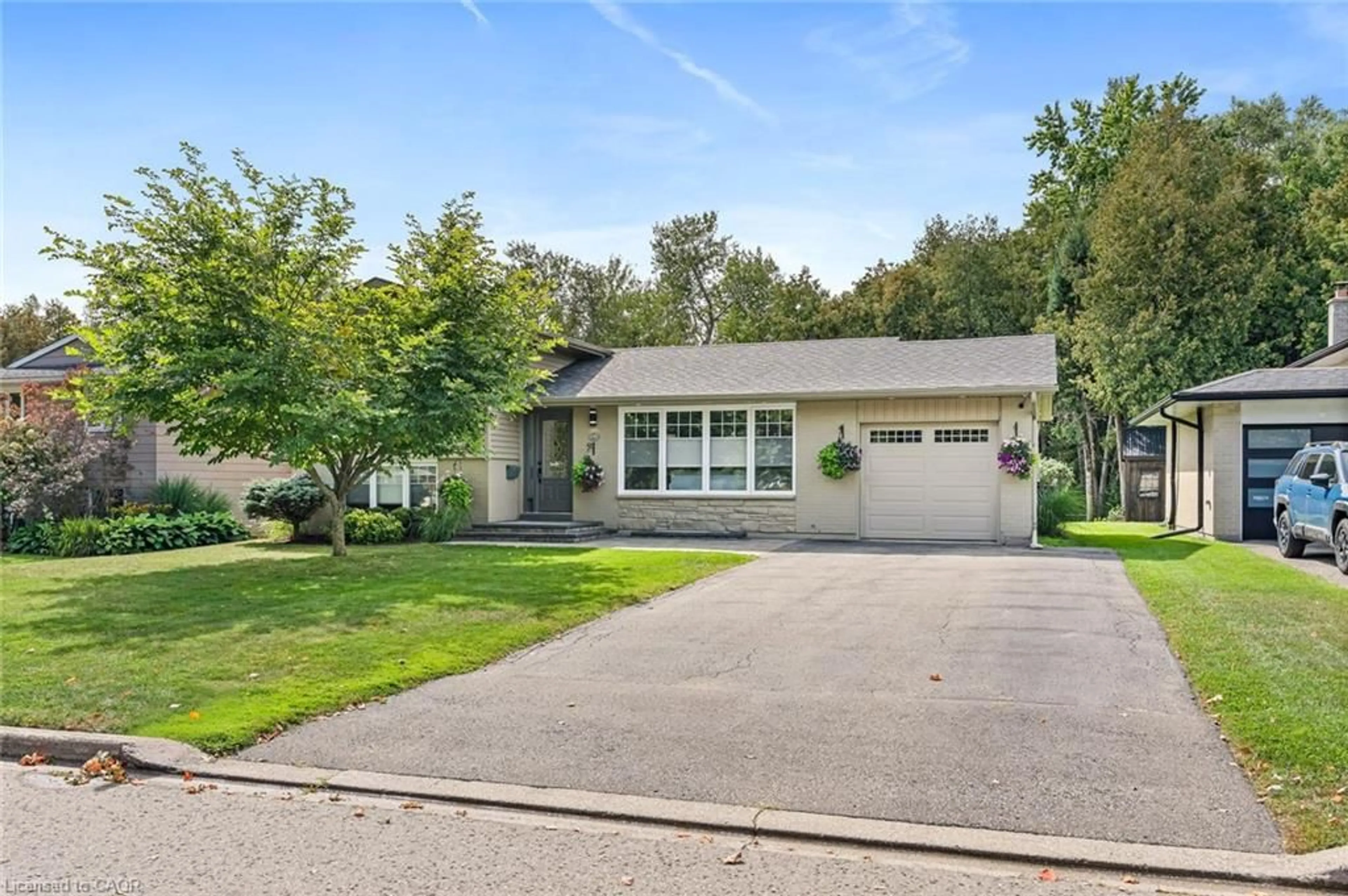 Home with vinyl exterior material, street for 132 Elmore Dr, Acton Ontario L7J 1T2